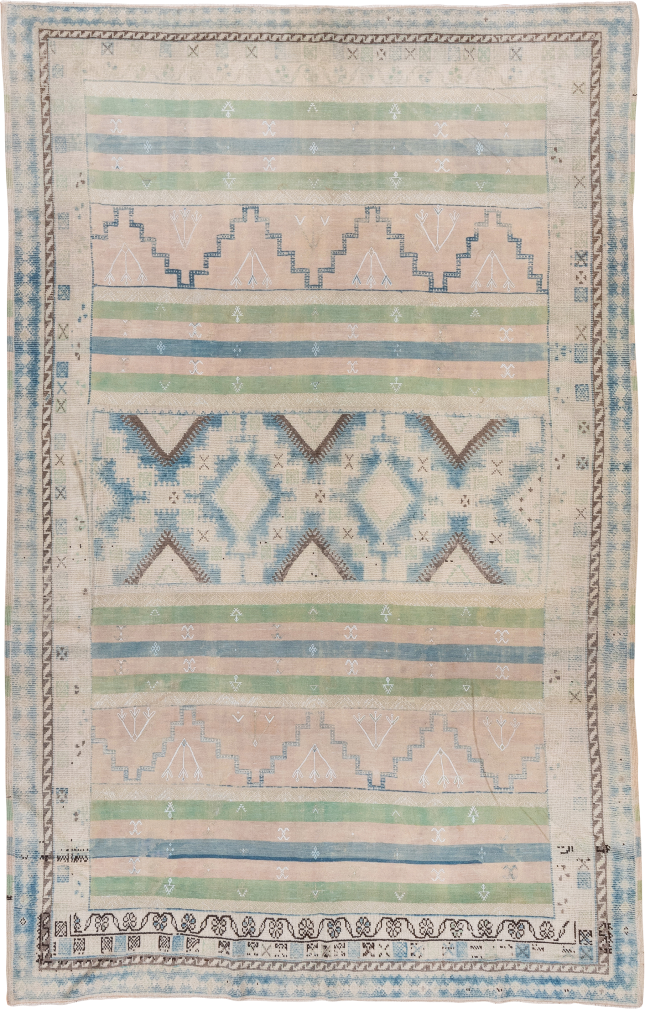 6' x 9' one-of-a-kind handmade antique Moroccan medium size rug. Color palette: ivory, pale blue, sage, blush, taupe, brown