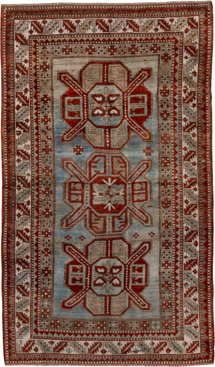 4' x 7' one-of-a-kind handmade antique Kazak rug. Color palette: rust, ivory, sky blue, taupe, brick, camel, terracotta