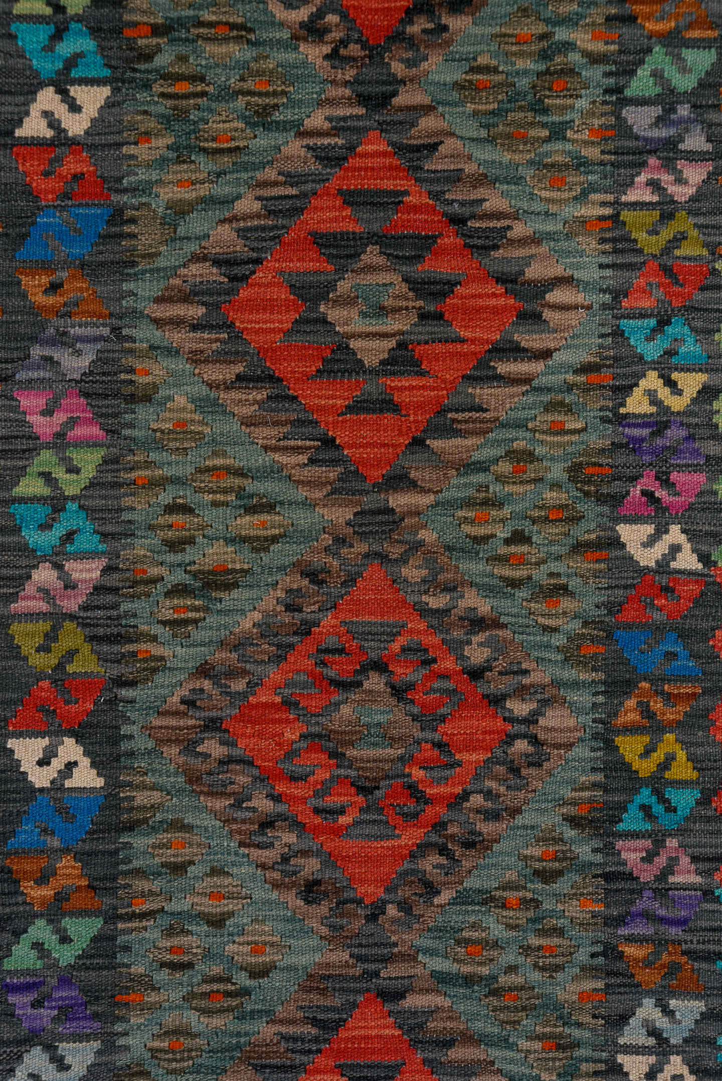 2' x 9' one-of-a-kind handmade vintage Kilim runner rug. Color palette: charcoal, crimson, turquoise, coral, ivory, lavender
