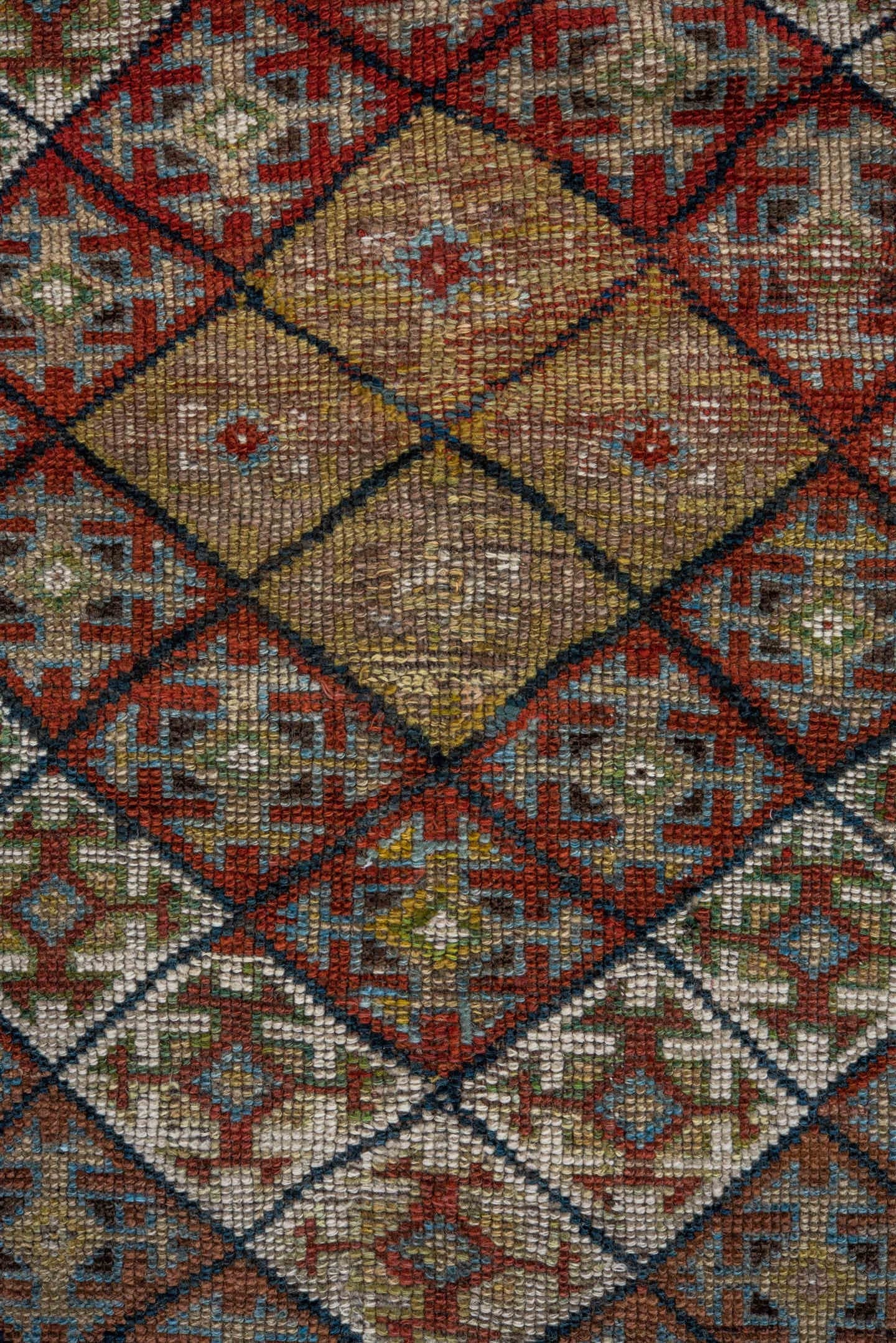 4' x 8' one-of-a-kind handmade antique Kurd rug. Color palette: camel, ivory, rust, sky blue, navy, taupe, gold, brown