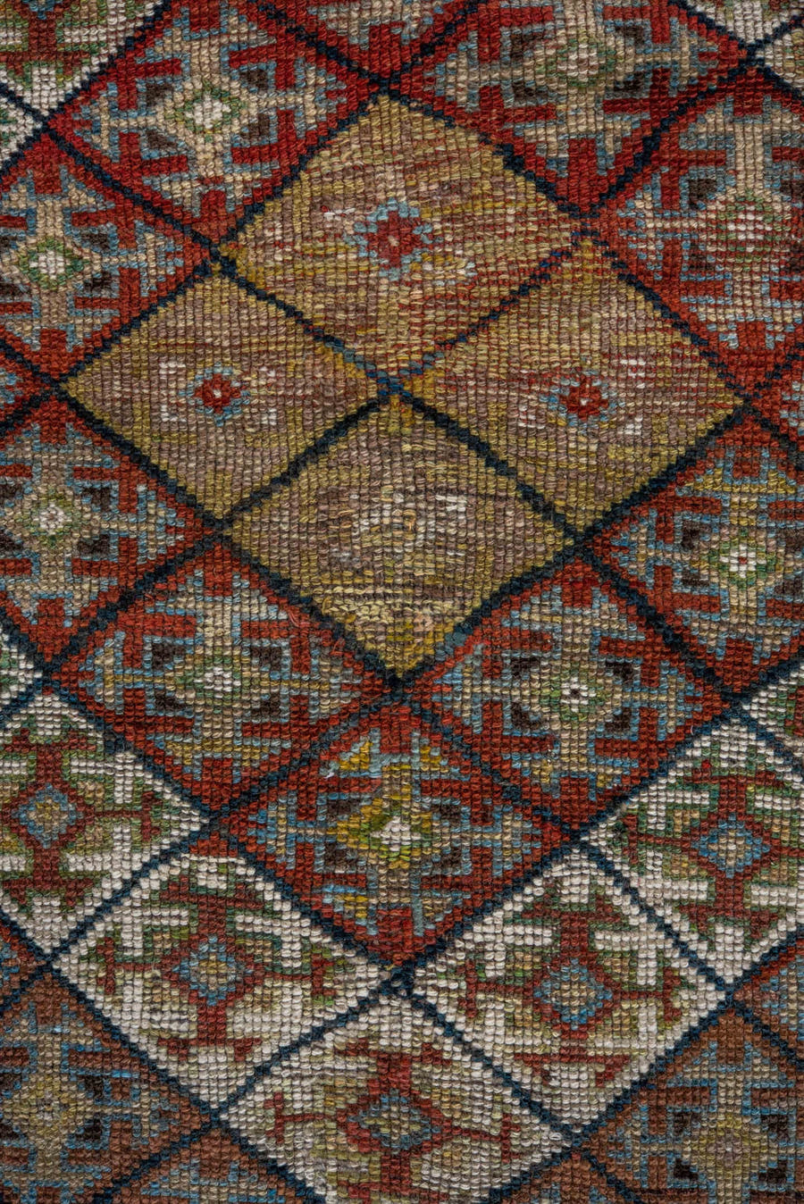 4' x 8' one-of-a-kind handmade antique Kurd rug. Color palette: camel, ivory, rust, sky blue, navy, taupe, gold, brown