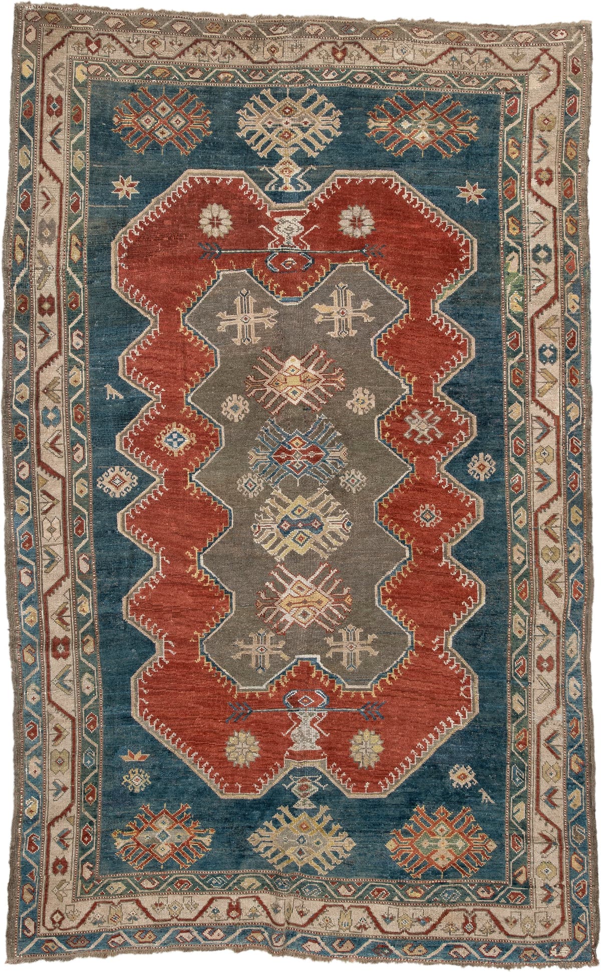 5' x 8' one-of-a-kind handmade antique Caucasian medium size rug. Color palette: teal, rust, ivory, taupe, terracotta, ochre