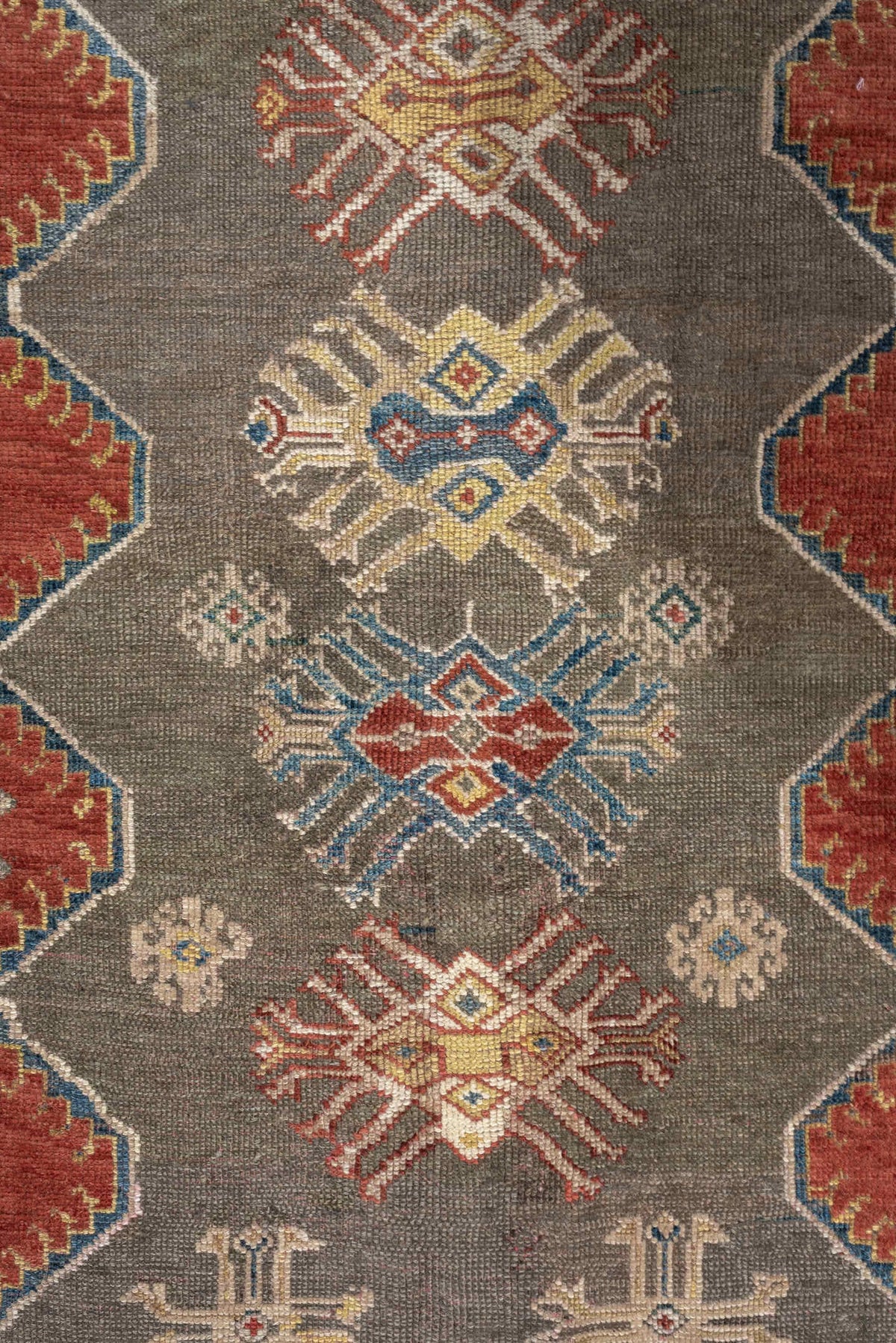 5' x 8' one-of-a-kind handmade antique Caucasian medium size rug. Color palette: teal, rust, ivory, taupe, terracotta, ochre