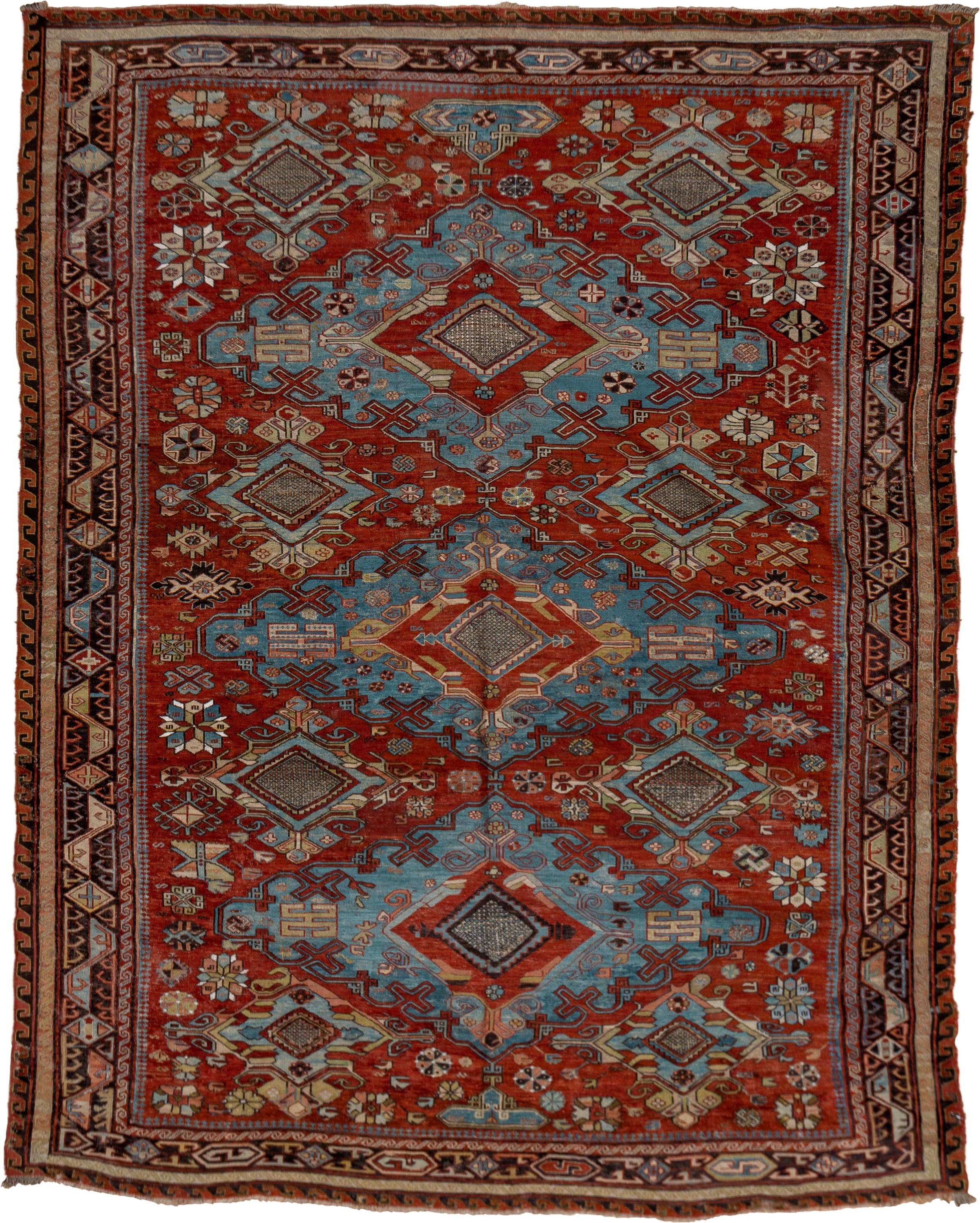 6' x 8' one-of-a-kind handmade antique Sumak medium size rug. Color palette: rust, sky blue, ivory, charcoal, camel