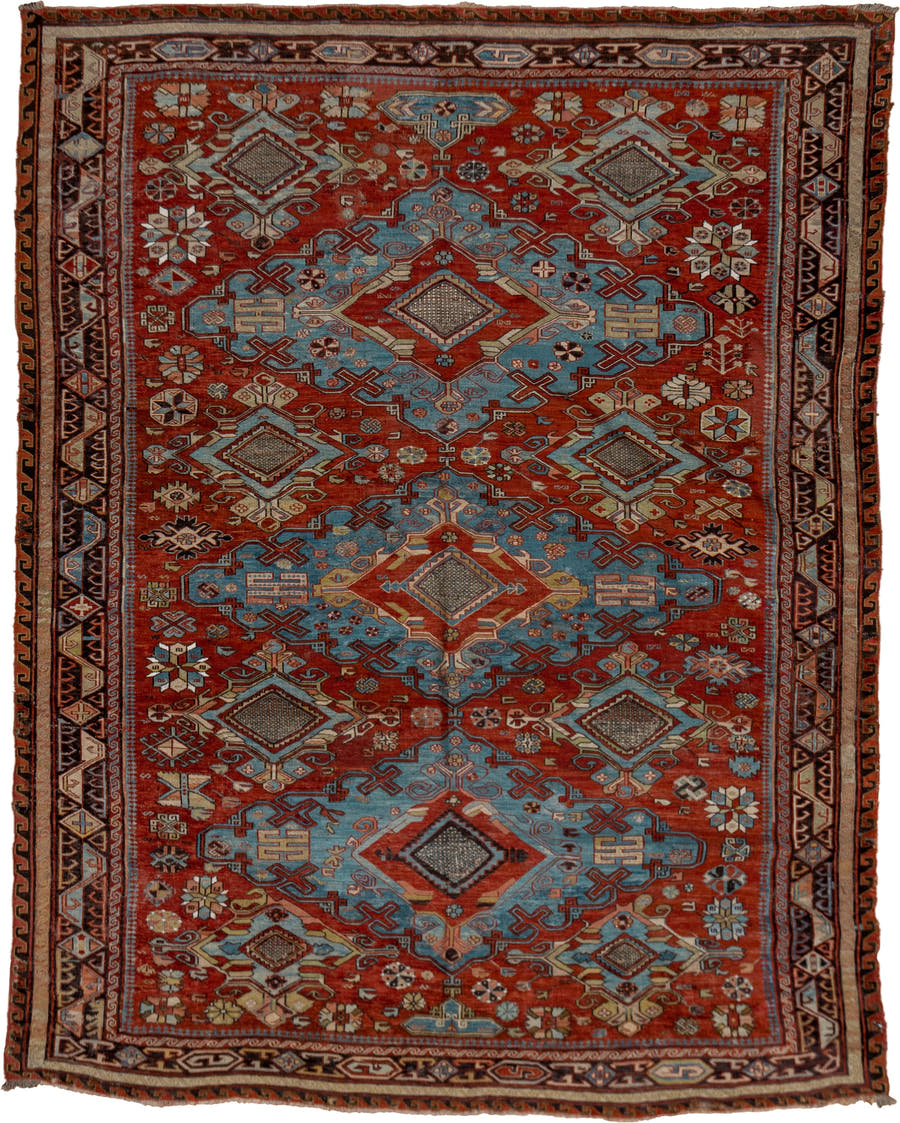 6' x 8' one-of-a-kind handmade antique Sumak medium size rug. Color palette: rust, sky blue, ivory, charcoal, camel