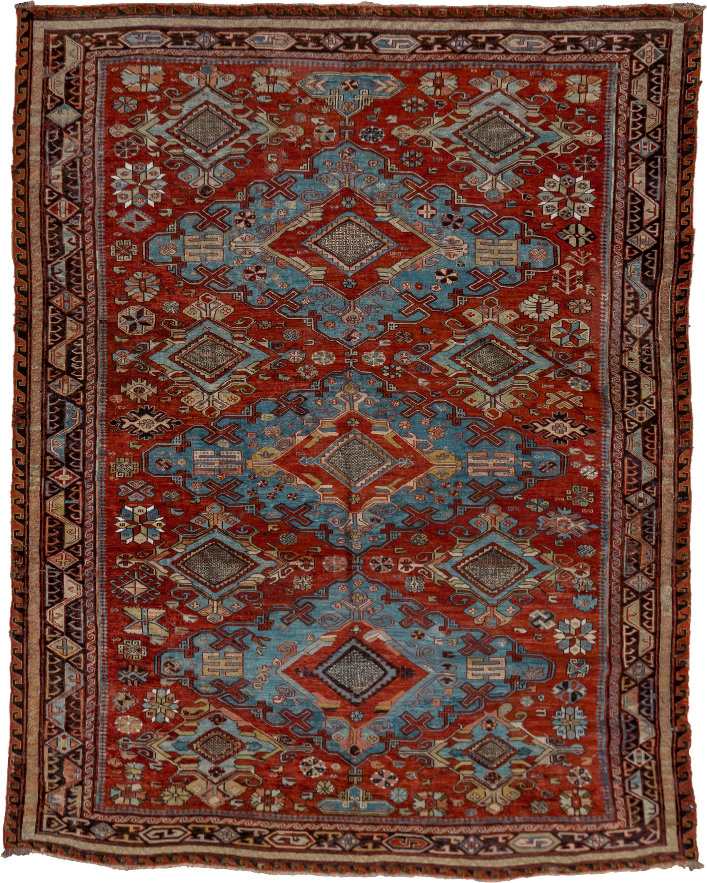 6' x 8' one-of-a-kind handmade antique Sumak medium size rug. Color palette: rust, sky blue, ivory, charcoal, camel