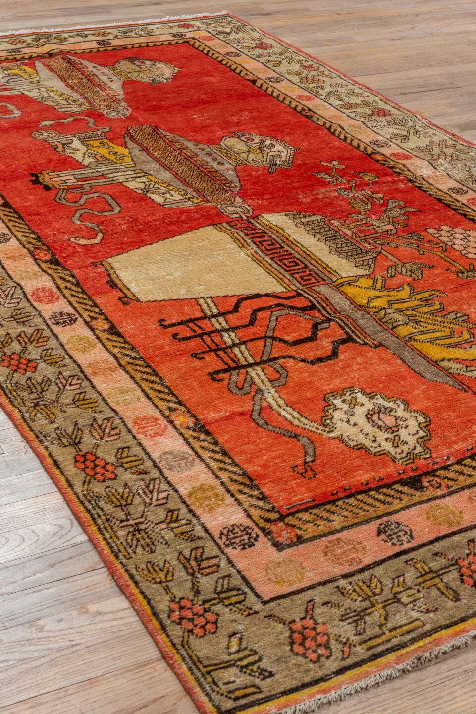 4' x 8' one-of-a-kind handmade antique Khotan rug. Color palette: red, ivory, camel, charcoal, coral, gold, taupe, rose