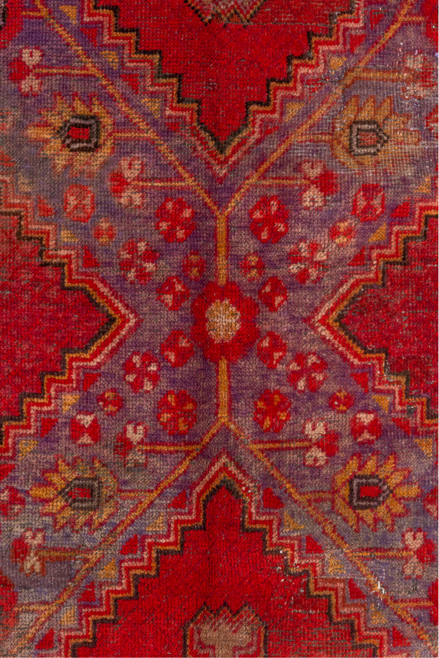 5' x 12' one-of-a-kind handmade antique Khotan rug. Color palette: red, crimson, rose, lavender, ivory, taupe, charcoal