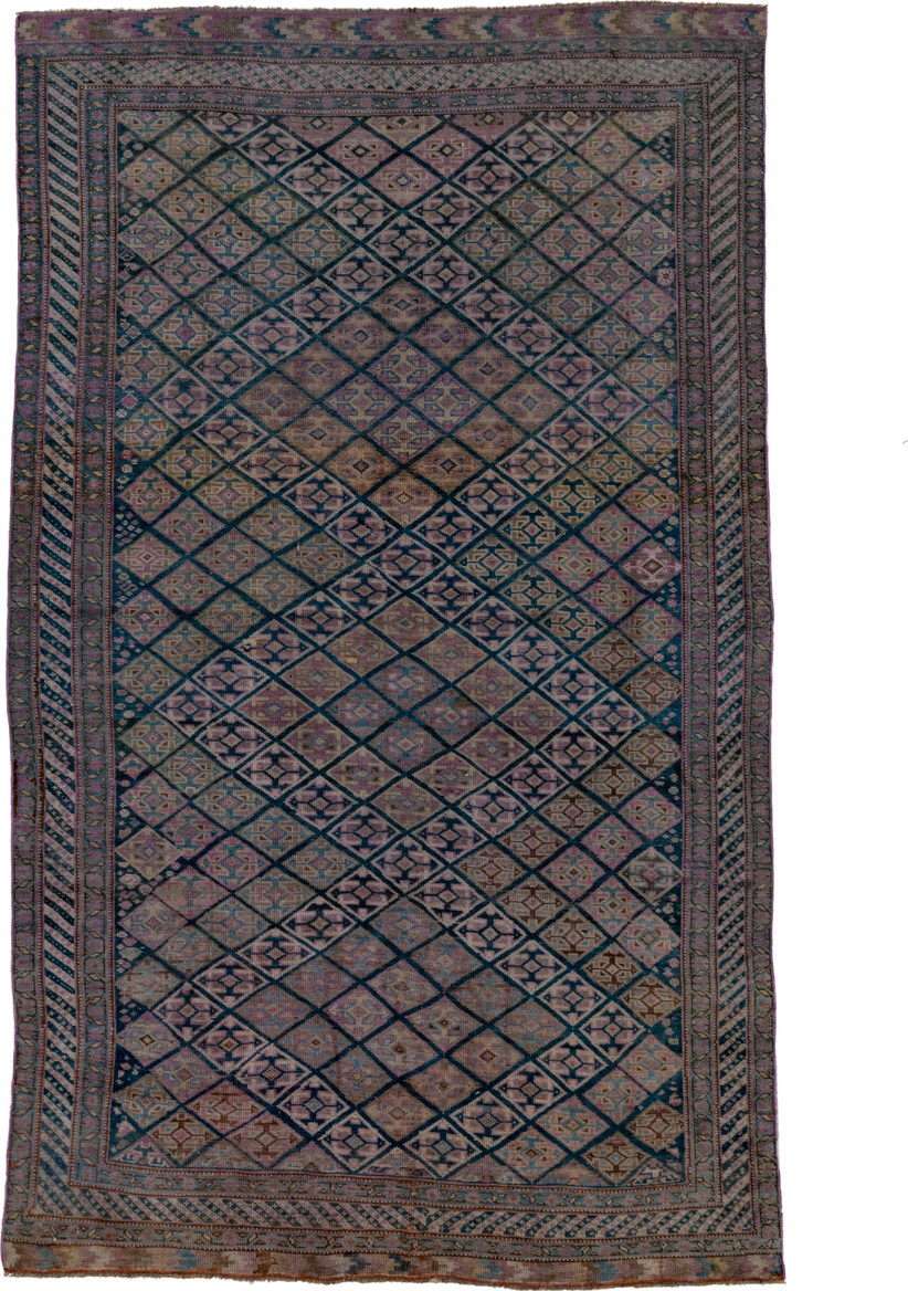 4' x 7' one-of-a-kind handmade antique Qashqai rug. Color palette: taupe, indigo, mauve, dusty rose, ivory, slate, camel