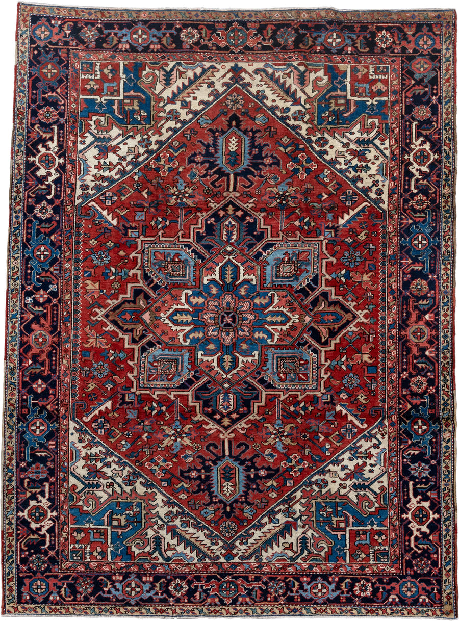 7' x 10' one-of-a-kind handmade antique Heriz large size rug. Color palette: rust, navy, ivory, sky_blue, coral, camel