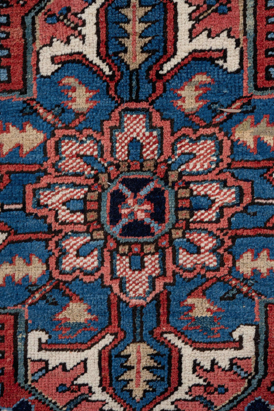 7' x 10' one-of-a-kind handmade antique Heriz large size rug. Color palette: rust, navy, ivory, sky_blue, coral, camel