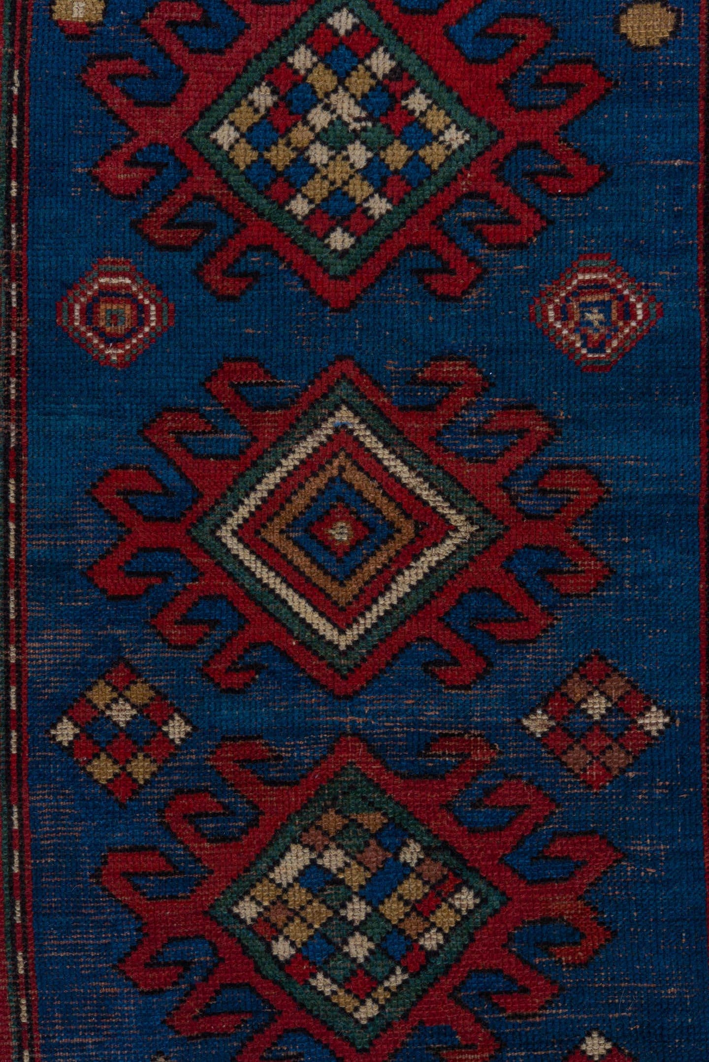 3' x 6' one-of-a-kind handmade antique Kazak small size rug. Color palette: blue, rust, ivory, navy, crimson, gold, teal