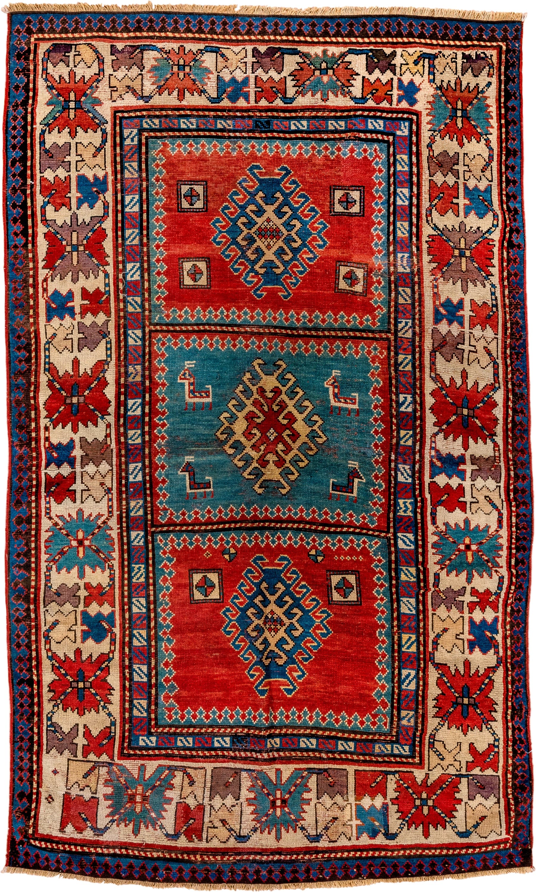 4' x 7' one-of-a-kind handmade antique Kazak rug. Color palette: ivory, red, sky blue, navy, rust, taupe, teal, light blue