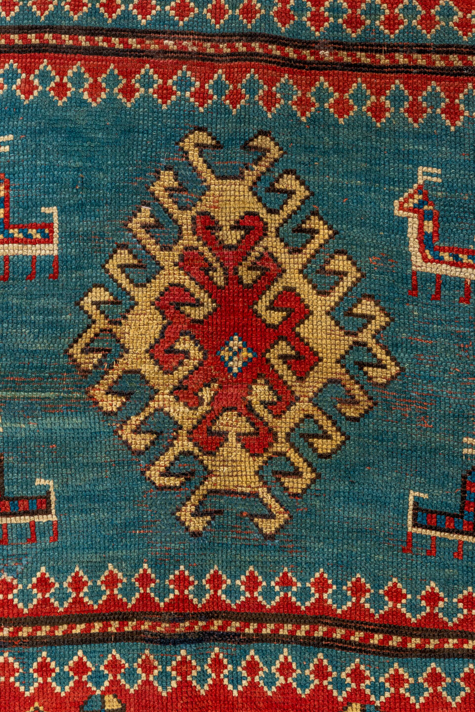 4' x 7' one-of-a-kind handmade antique Kazak rug. Color palette: ivory, red, sky blue, navy, rust, taupe, teal, light blue