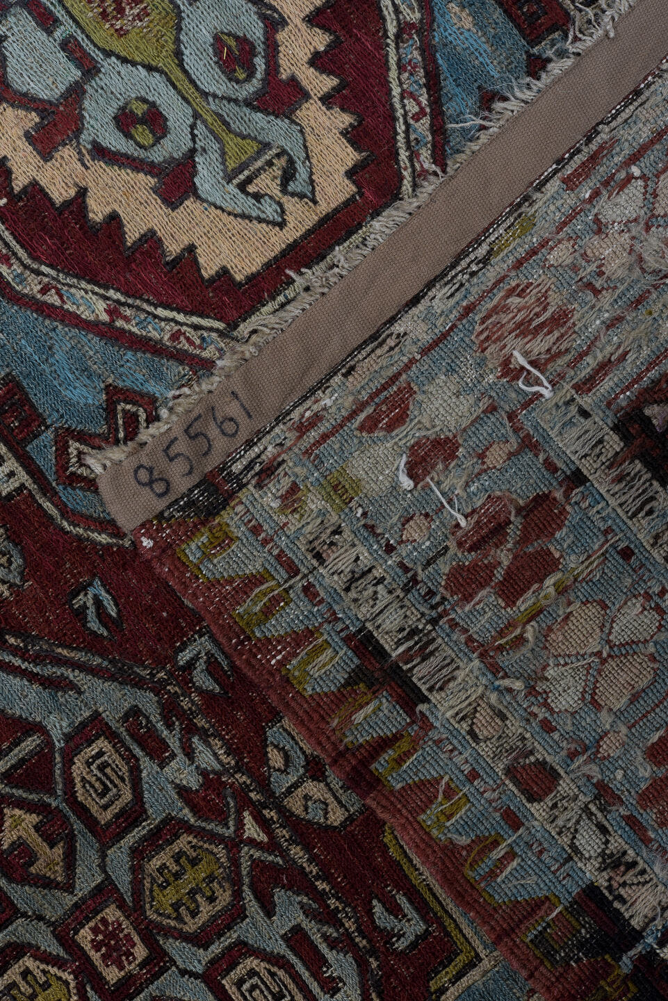 4' x 6' one-of-a-kind handmade antique Sumak rug. Color palette: rust, powder blue, ivory, charcoal, burgundy, camel, slate