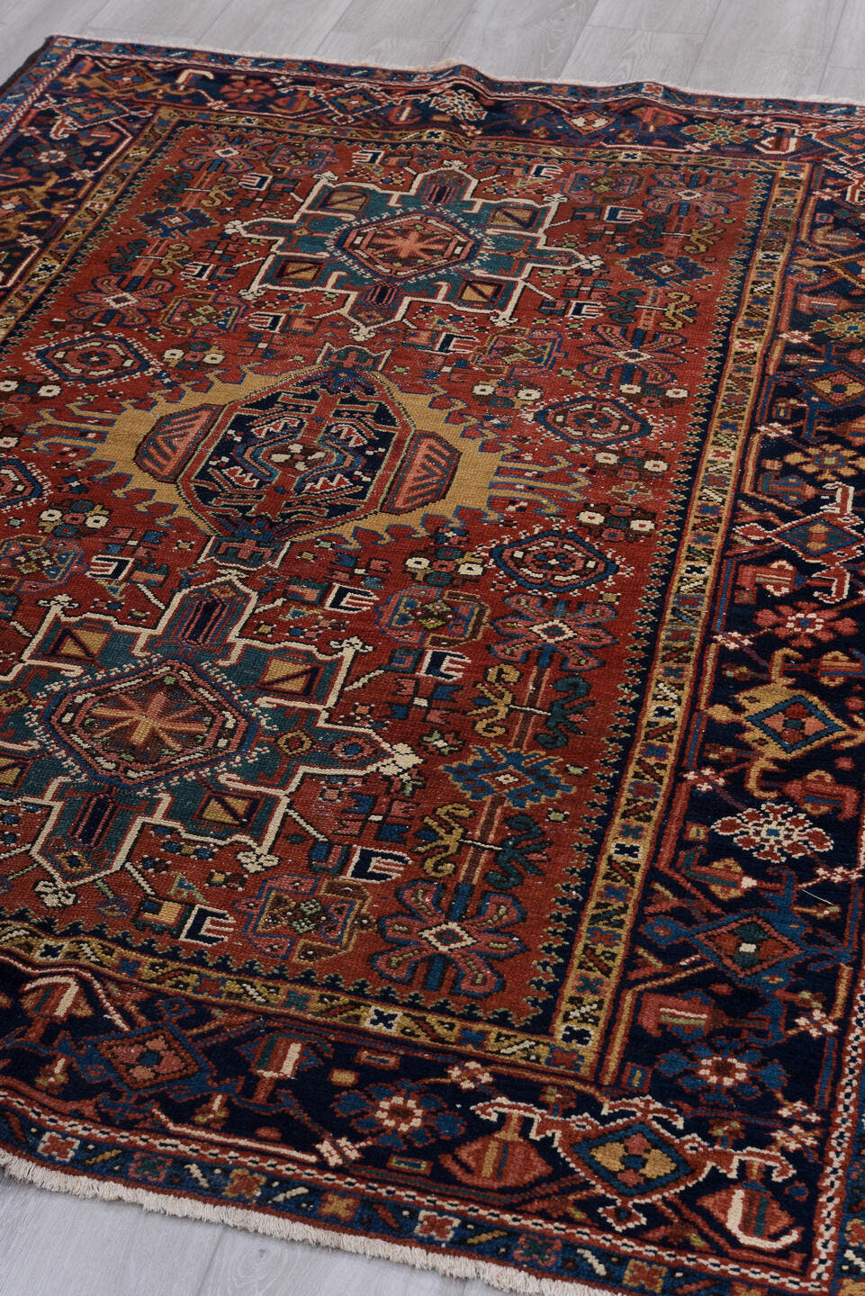 4' x 6' one-of-a-kind handmade vintage Karaje small size rug. Color palette: rust, navy, ivory, sky_blue, camel, rose