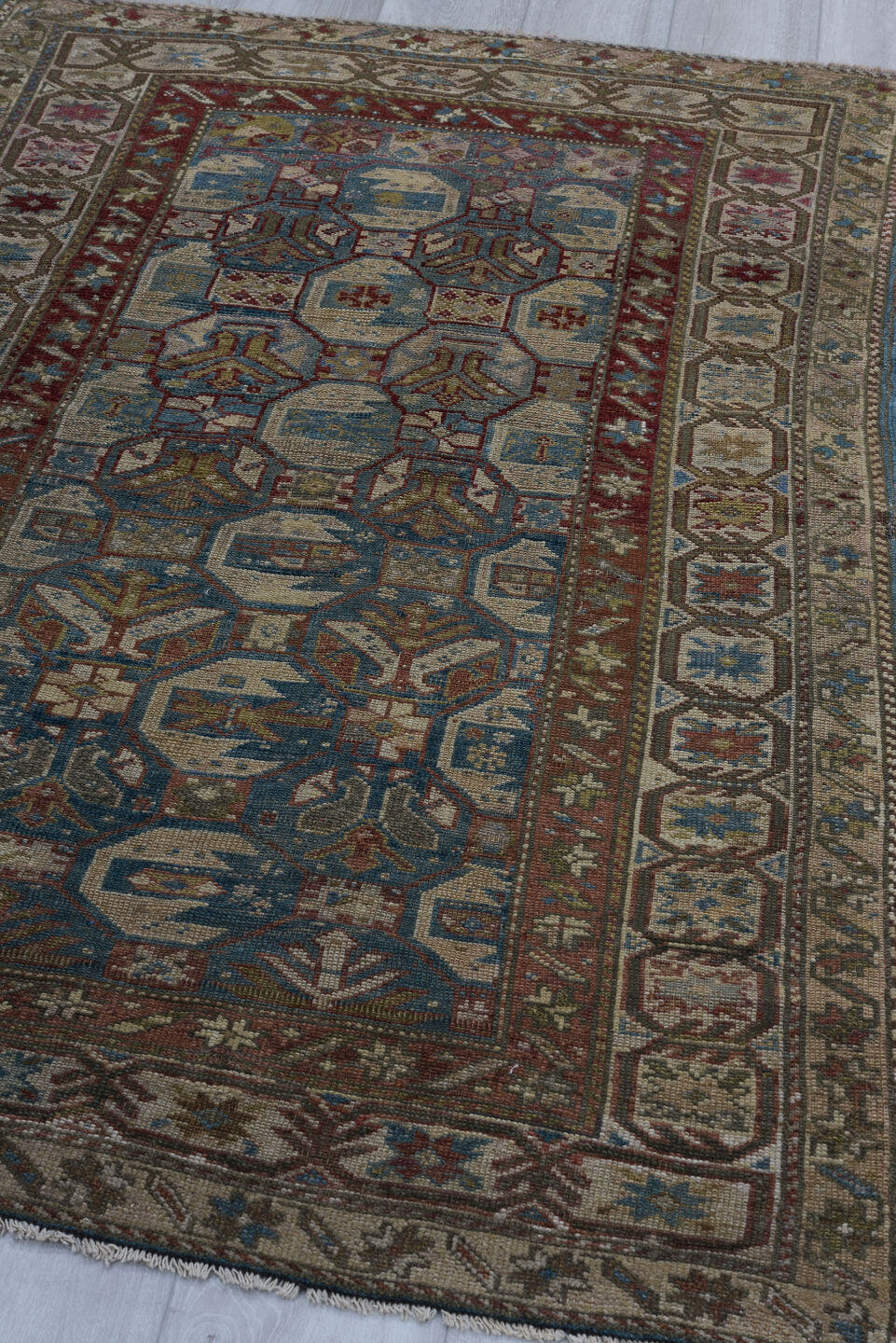 3' x 5' one-of-a-kind handmade vintage Caucasian small size rug. Color palette: ivory, brown, blue, rust, taupe, burgundy