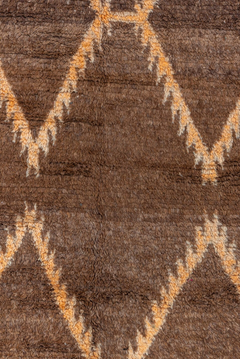 4' x 7' one-of-a-kind handmade vintage Moroccan rug. Color palette: brown, ivory, blush, taupe, charcoal, teal, purple, gold