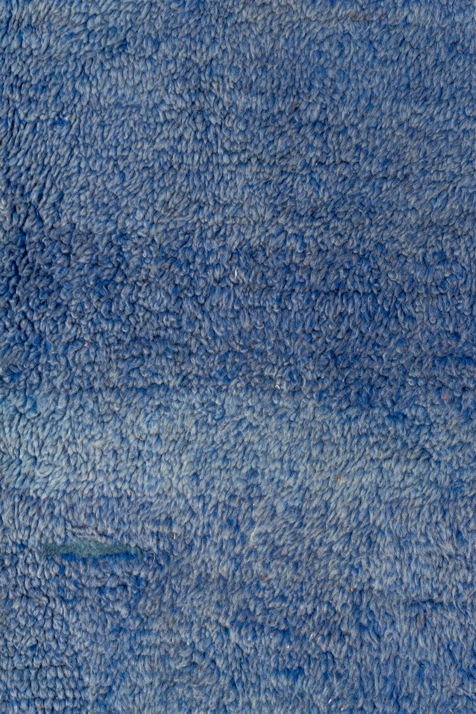 7' x 9' one-of-a-kind handmade antique Moroccan rug. Color palette: blue, cobalt, indigo, purple