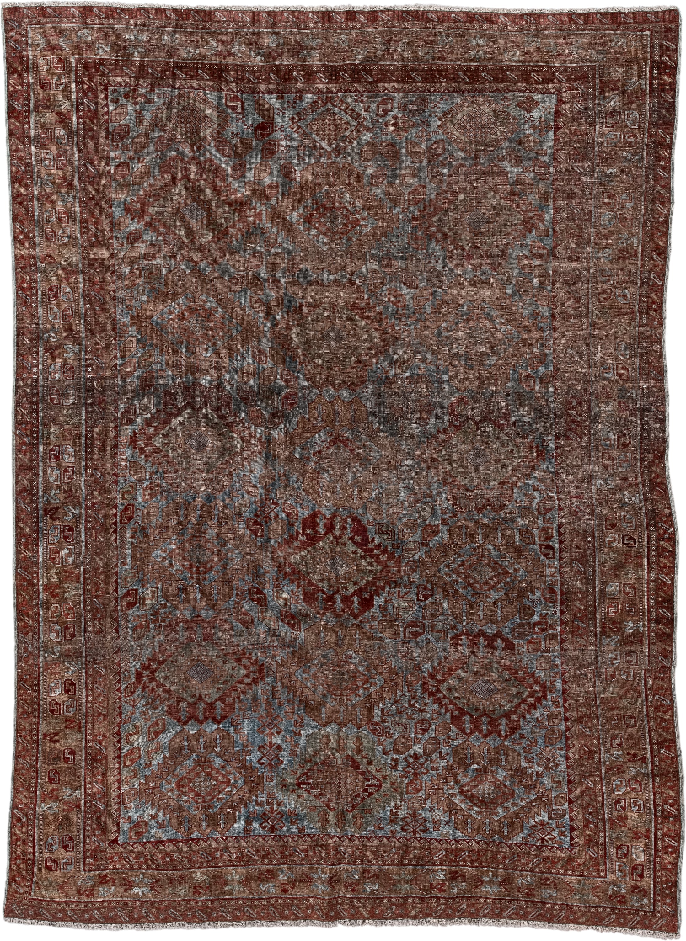 6' x 9' one-of-a-kind handmade antique Belouch rug. Color palette: rust, dusty blue, ivory, taupe, burgundy, brown