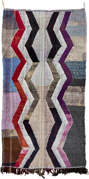 4' x 8' one-of-a-kind handmade vintage Rag Rug rug. Color palette: ivory, charcoal, plum, crimson, lavender, sky blue, brown