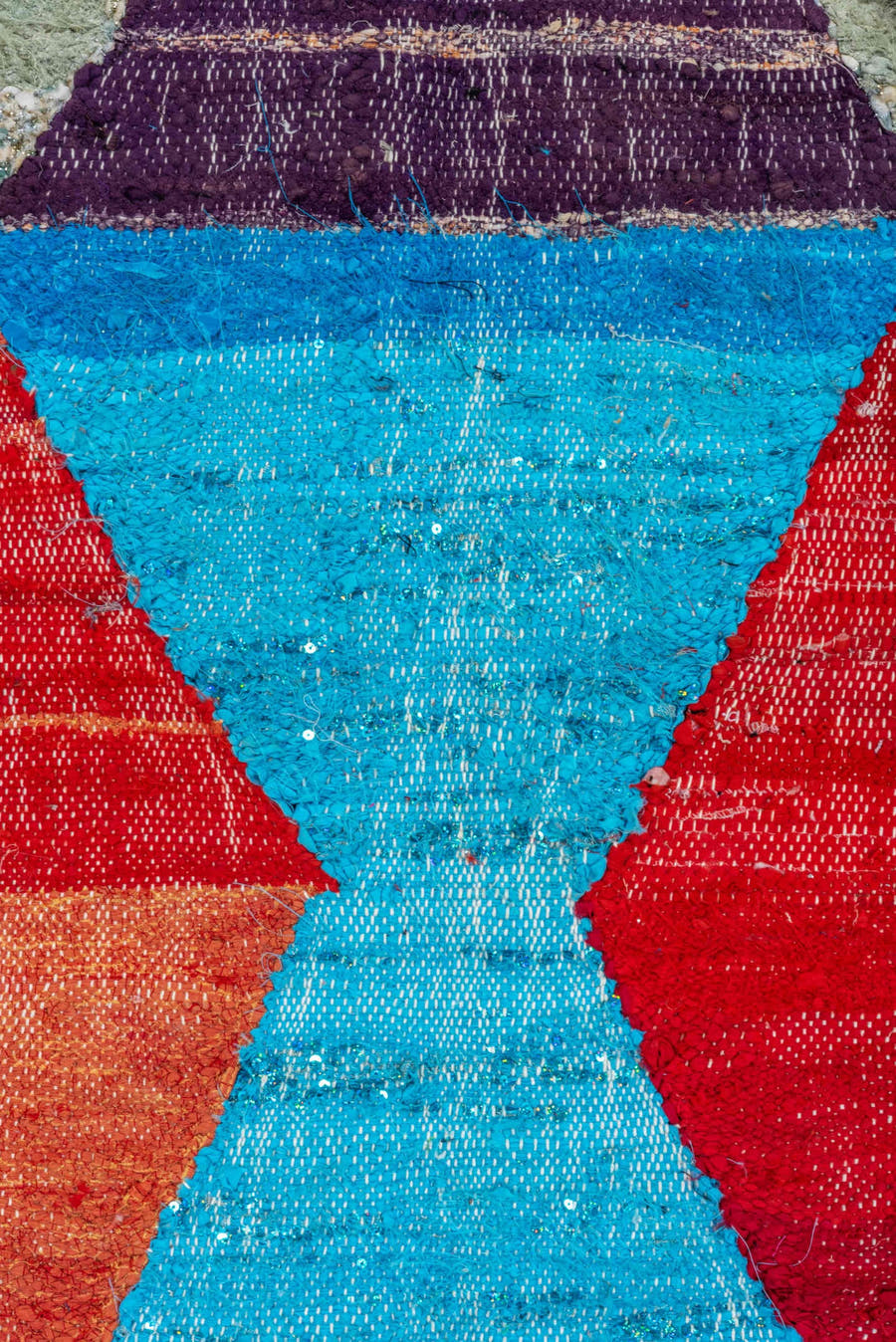 4' x 8' one-of-a-kind handmade vintage Rag Rug rug. Color palette: ivory, turquoise, navy, coral, plum, pink, orange, gray