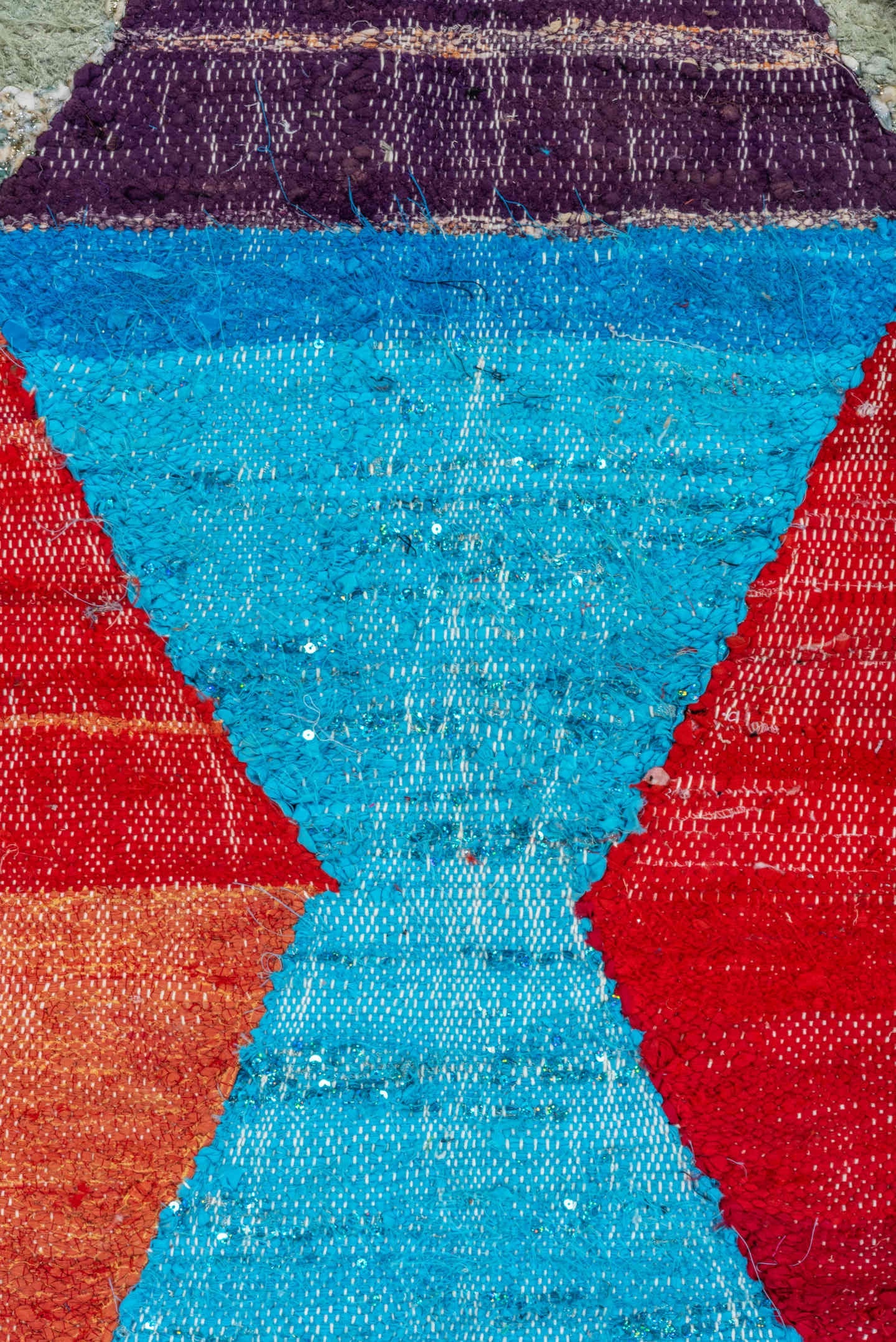 4' x 8' one-of-a-kind handmade vintage Rag Rug rug. Color palette: ivory, turquoise, navy, coral, plum, pink, orange, gray