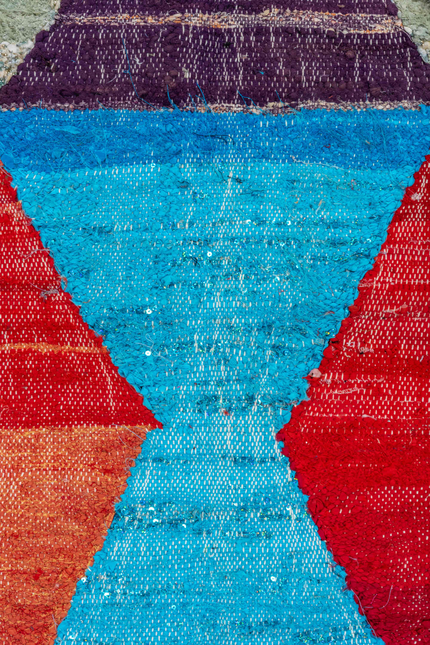 4' x 8' one-of-a-kind handmade vintage Rag Rug rug. Color palette: ivory, turquoise, navy, coral, plum, pink, orange, gray