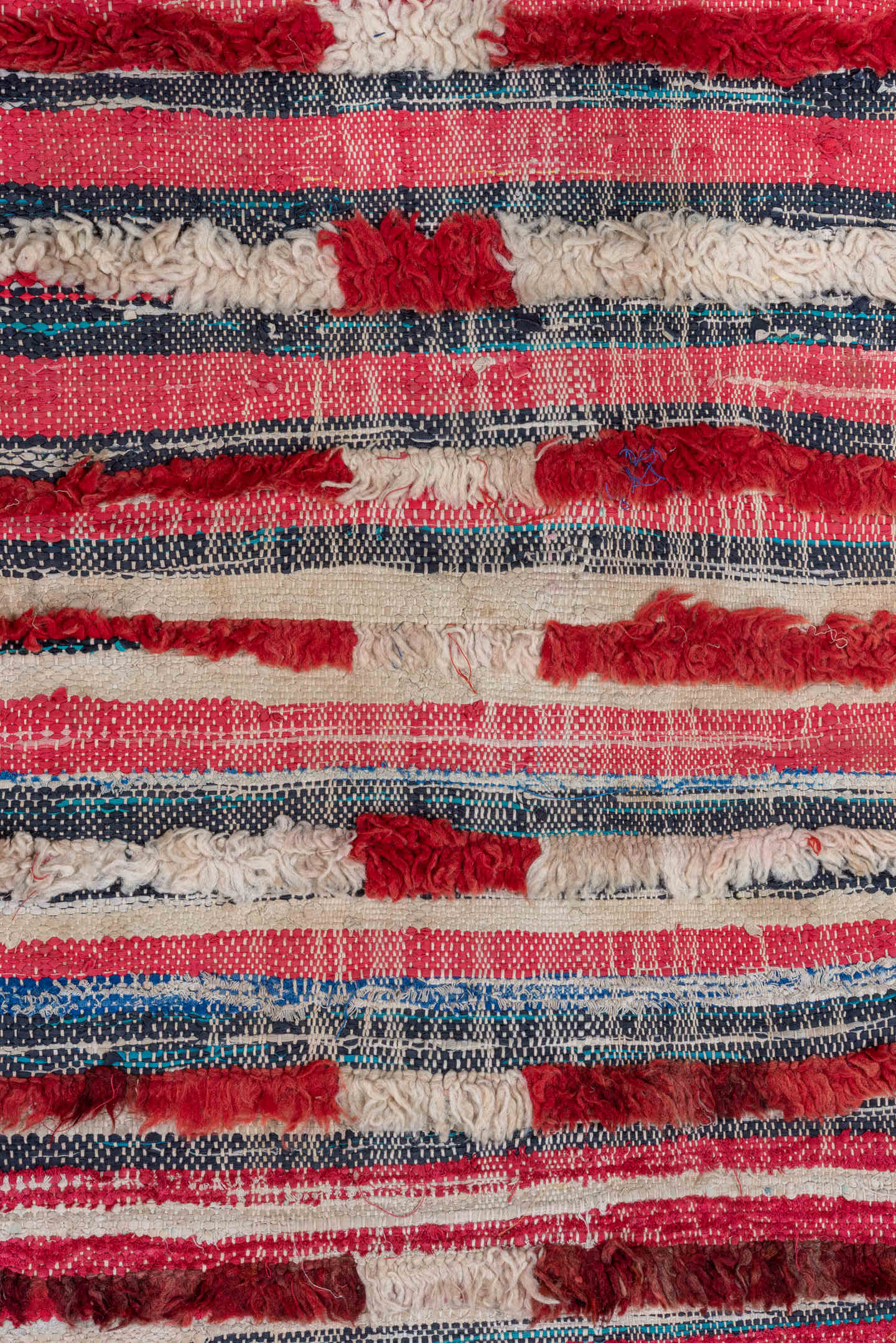 2' x 6' one-of-a-kind handmade vintage Rag Rug runner rug. Color palette: ivory, crimson, rose, charcoal, navy, gold, red