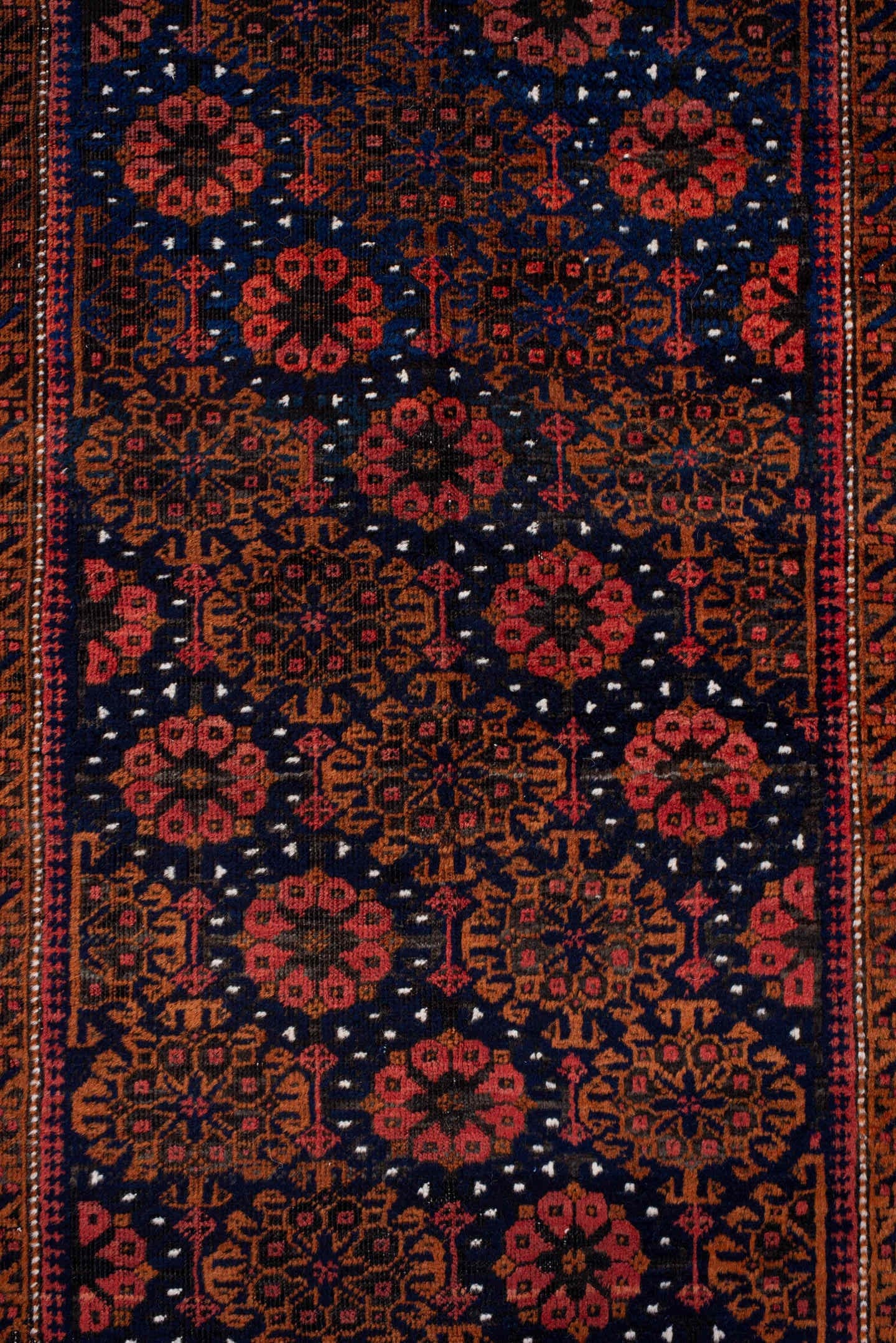 3' x 7' one-of-a-kind handmade antique Belouch rug. Color palette: rust, navy, terracotta, burgundy, camel, ivory, charcoal