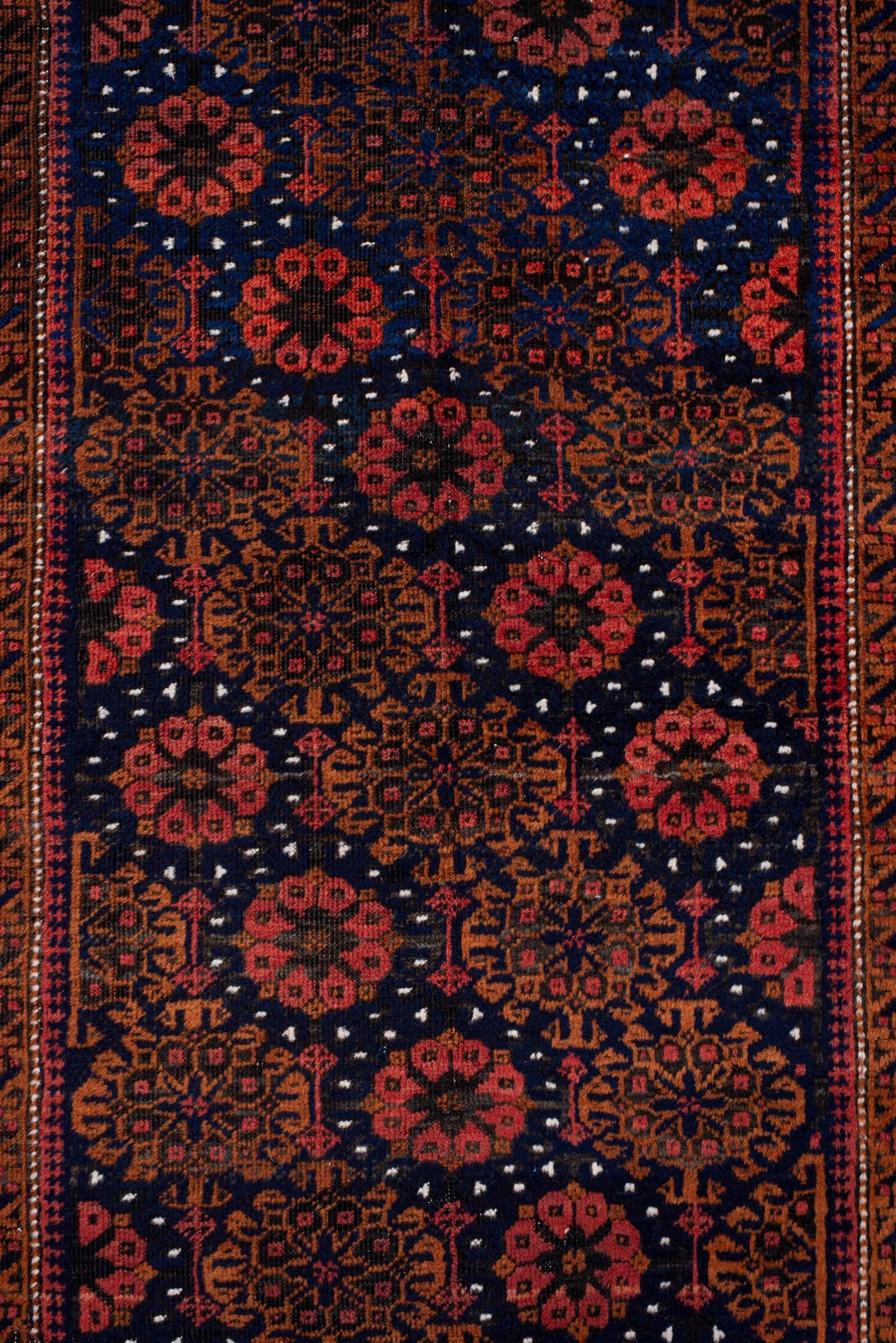 3' x 7' one-of-a-kind handmade antique Belouch rug. Color palette: rust, navy, terracotta, burgundy, camel, ivory, charcoal