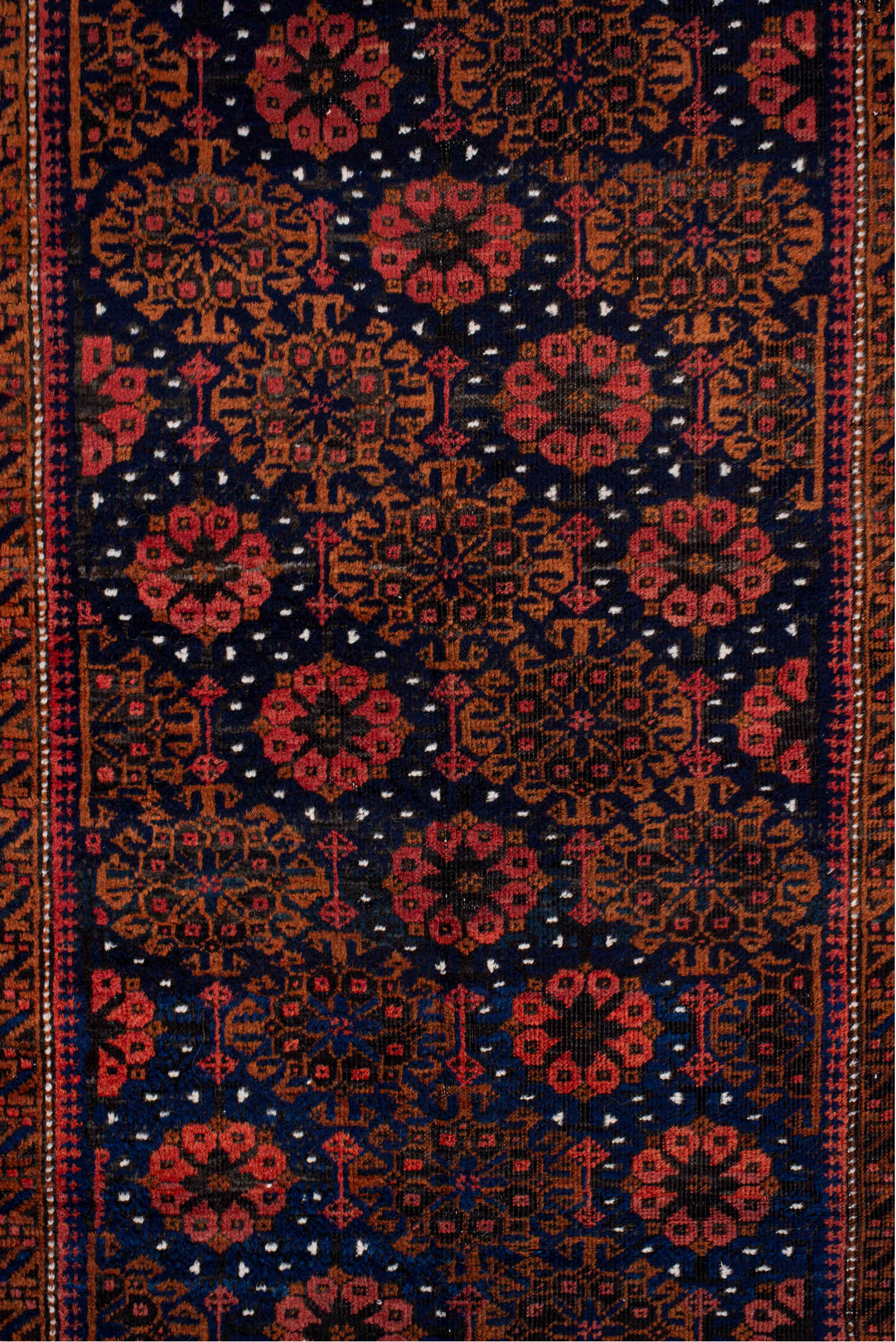 3' x 7' one-of-a-kind handmade antique Belouch rug. Color palette: rust, navy, terracotta, burgundy, camel, ivory, charcoal