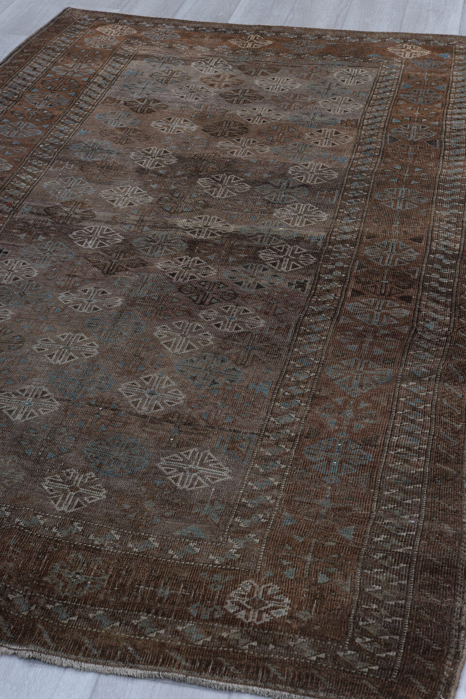 5' x 8' one-of-a-kind handmade vintage Belouch medium size rug. Color palette: brown, taupe, ivory, charcoal, slate, camel