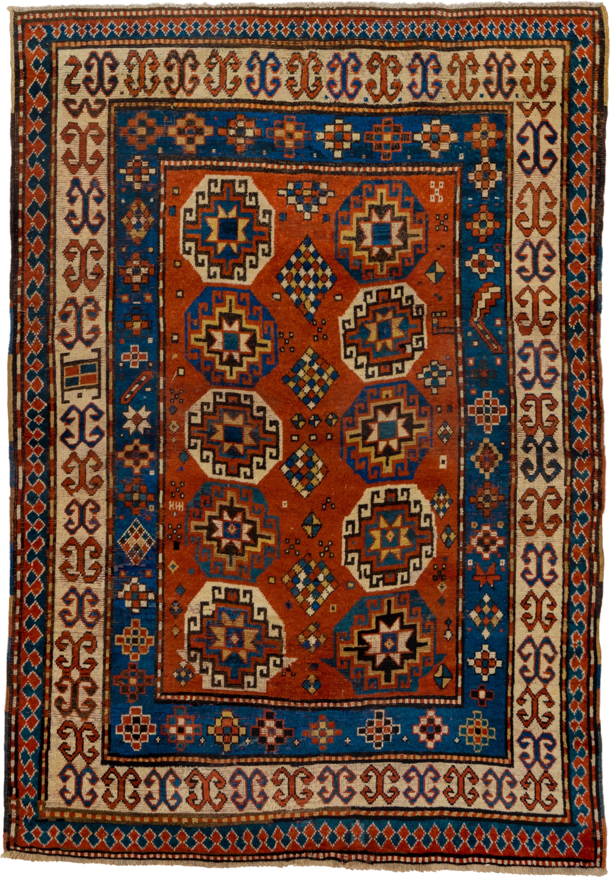 4' x 7' one-of-a-kind handmade antique Kazak rug. Color palette: rust, cobalt, ivory, camel, charcoal, gold, crimson