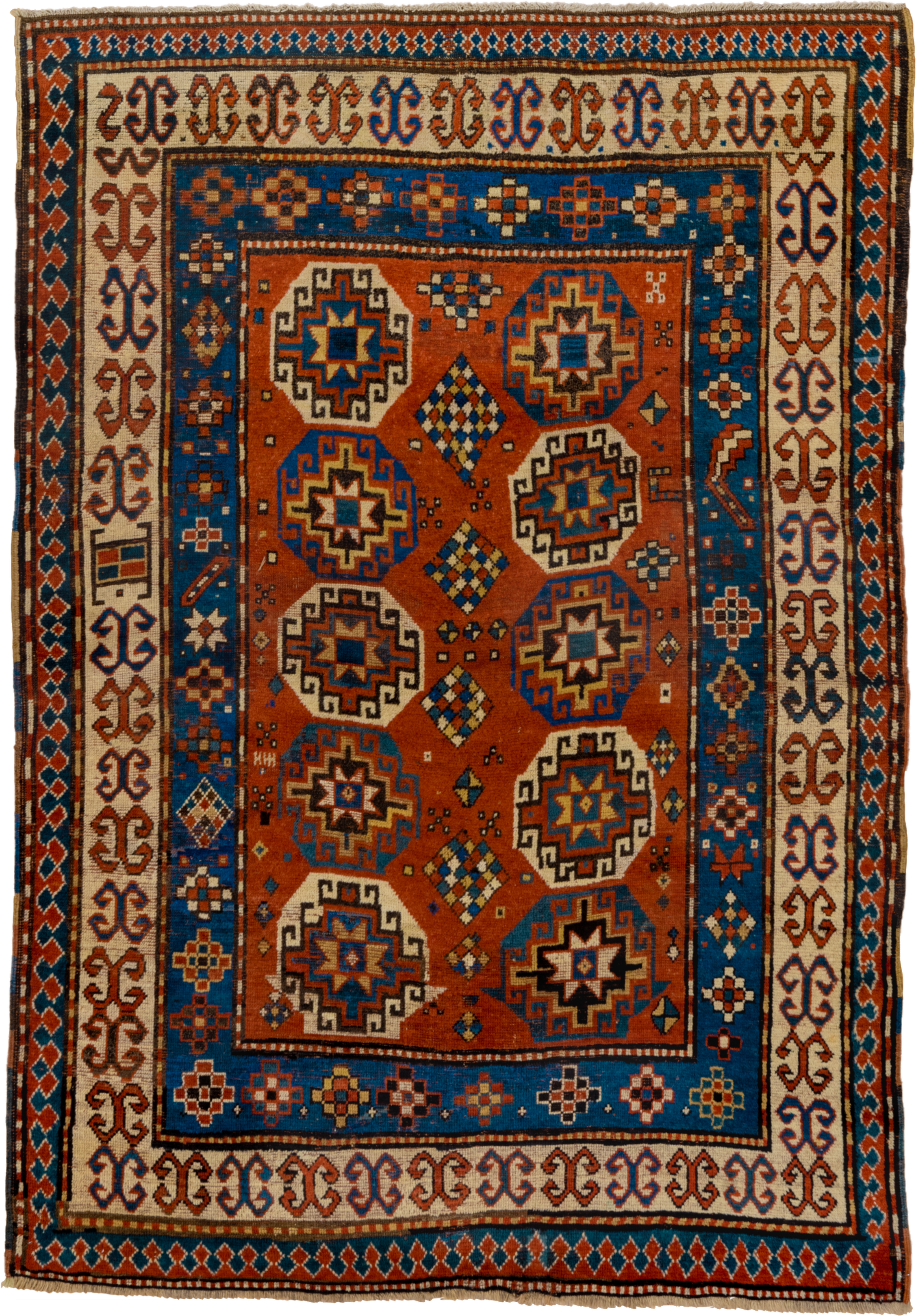 4' x 7' one-of-a-kind handmade antique Kazak rug. Color palette: rust, cobalt, ivory, camel, charcoal, gold, crimson