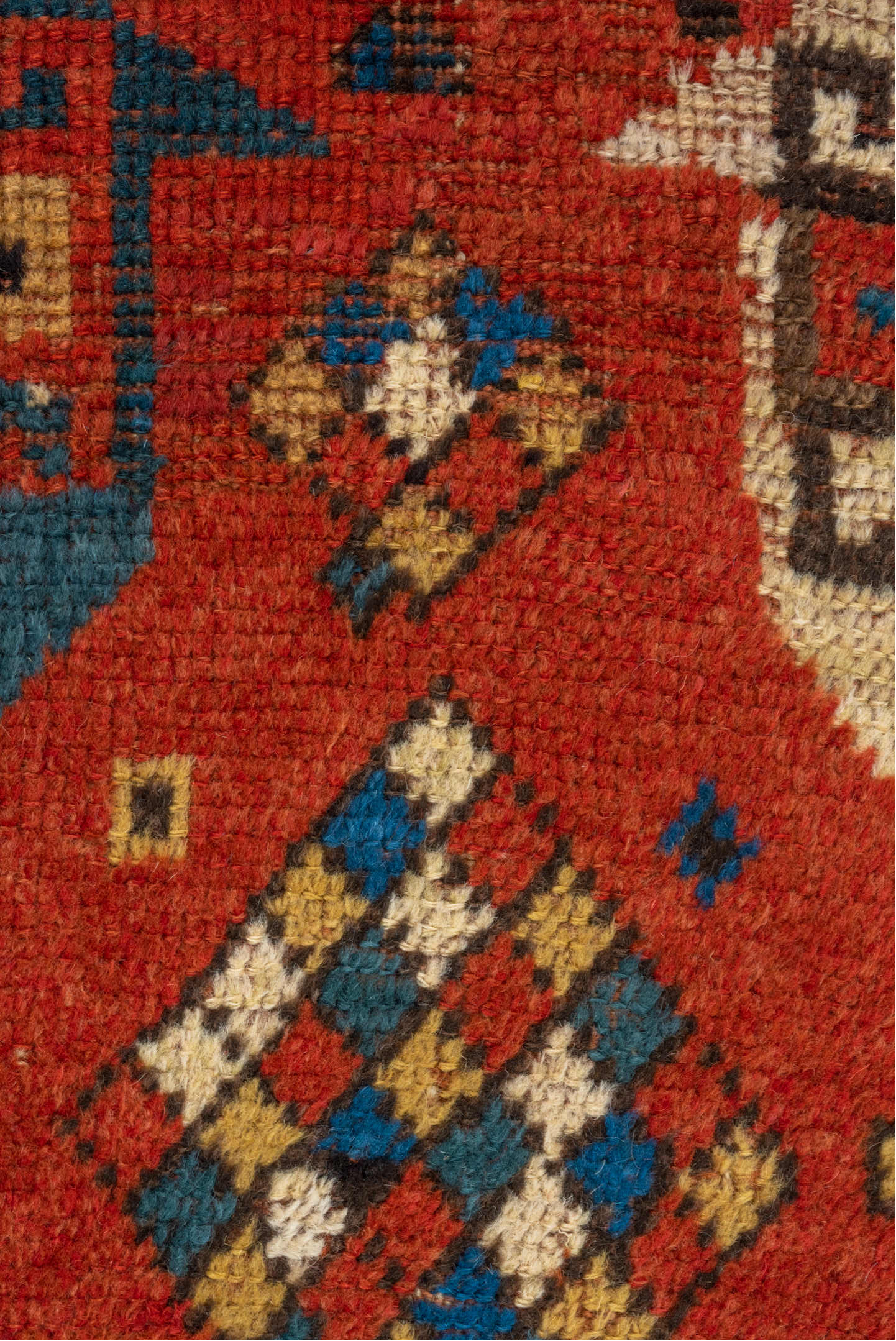 4' x 7' one-of-a-kind handmade antique Kazak rug. Color palette: rust, cobalt, ivory, camel, charcoal, gold, crimson