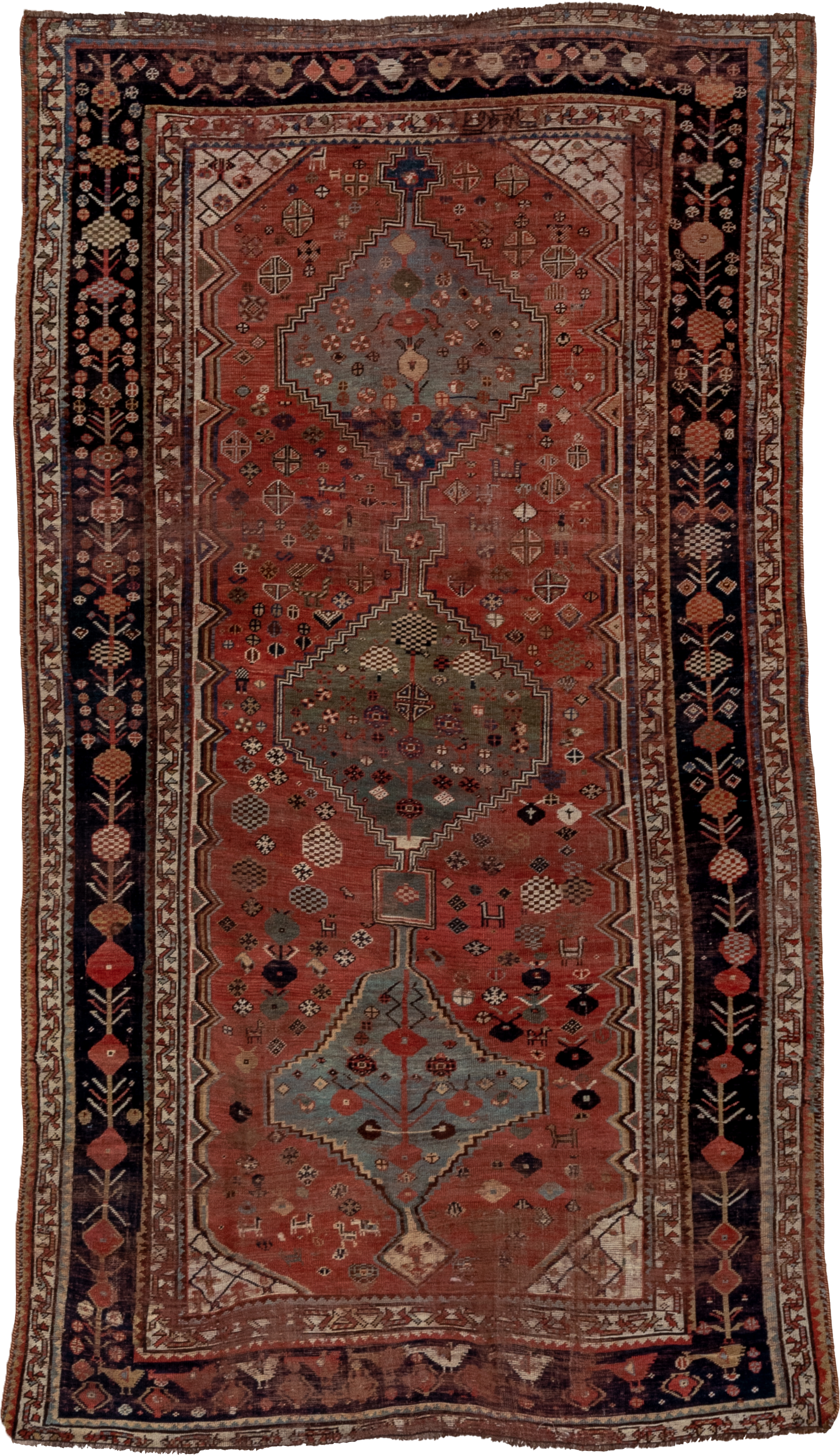 5' x 8' one-of-a-kind handmade antique Qashqai medium size rug. Color palette: rust, indigo, ivory, slate, terra cotta