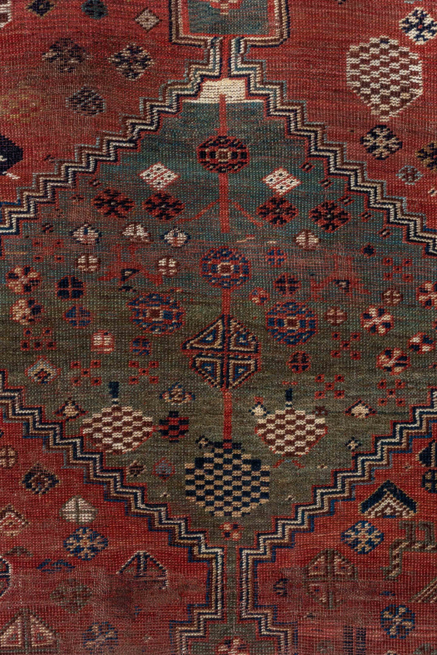 5' x 8' one-of-a-kind handmade antique Qashqai medium size rug. Color palette: rust, indigo, ivory, slate, terra cotta