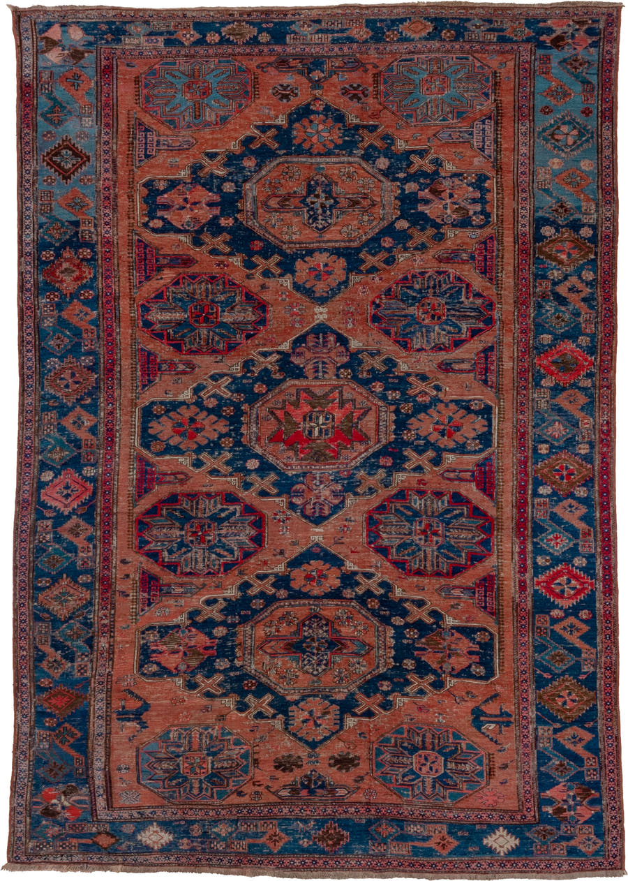 6' x 9' one-of-a-kind handmade antique Sumak medium size rug. Color palette: terra cotta, indigo, sky blue, rust, crimson