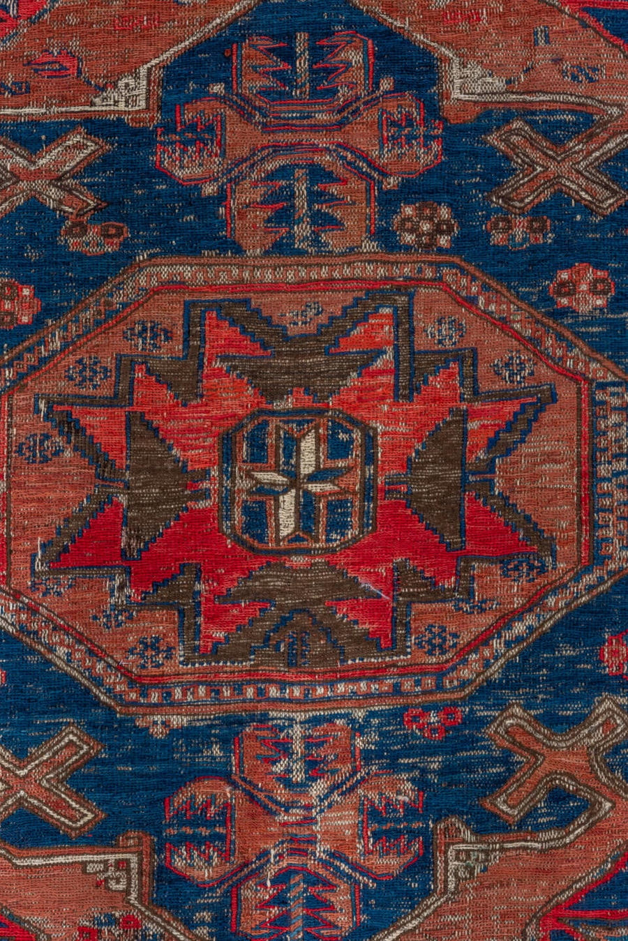 6' x 9' one-of-a-kind handmade antique Sumak medium size rug. Color palette: terra cotta, indigo, sky blue, rust, crimson