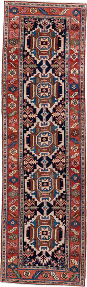 3' x 10' one-of-a-kind handmade antique Karaje runner rug. Color palette: navy, rust, ivory, sky blue, rose, sage, camel