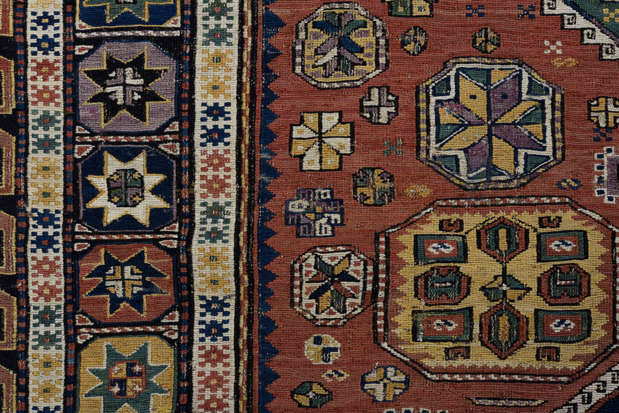 5' x 9' one-of-a-kind handmade vintage Sumak medium size rug. Color palette: rust, navy, ivory, sage, camel, charcoal