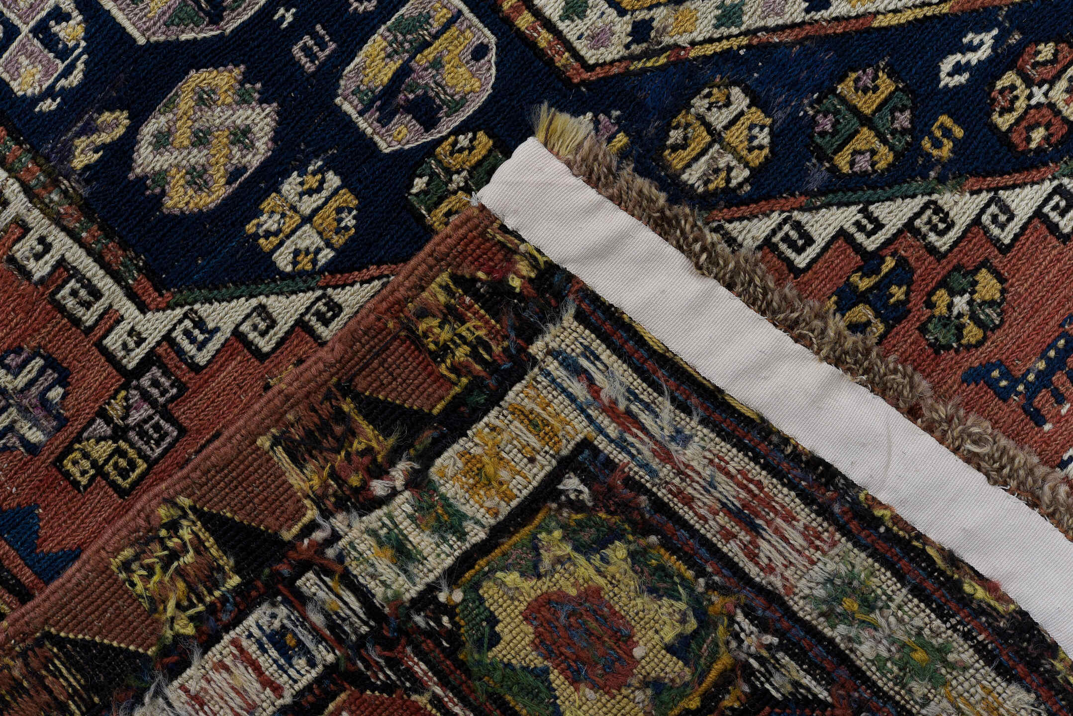 5' x 9' one-of-a-kind handmade vintage Sumak medium size rug. Color palette: rust, navy, ivory, sage, camel, charcoal