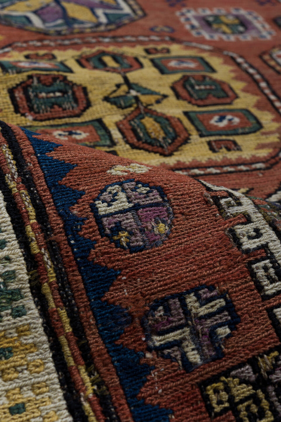 5' x 9' one-of-a-kind handmade vintage Sumak medium size rug. Color palette: rust, navy, ivory, sage, camel, charcoal