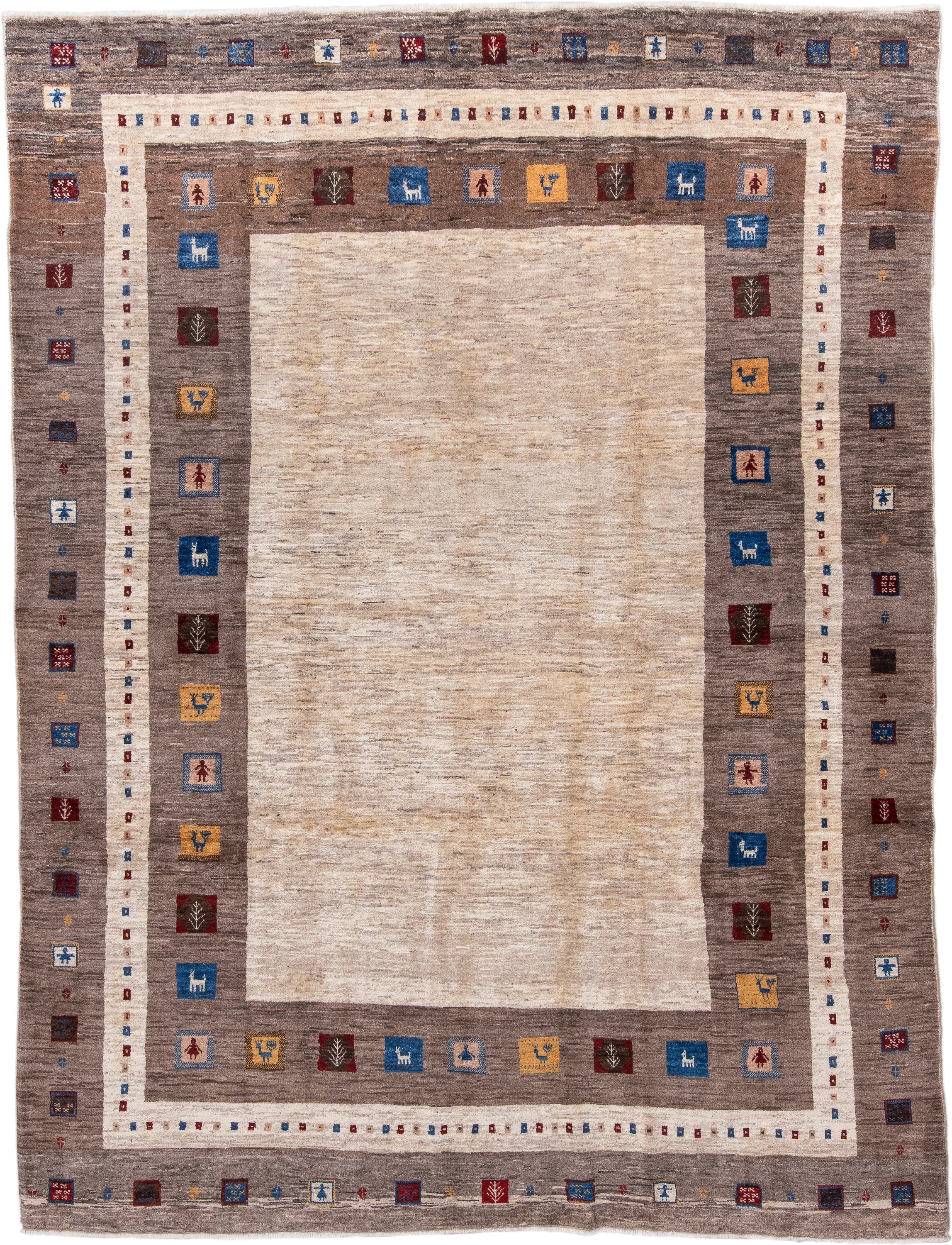 7' x 9' one-of-a-kind handmade vintage Gabbe rug. Color palette: ivory, taupe, brown, indigo, burgundy, gold, camel, beige