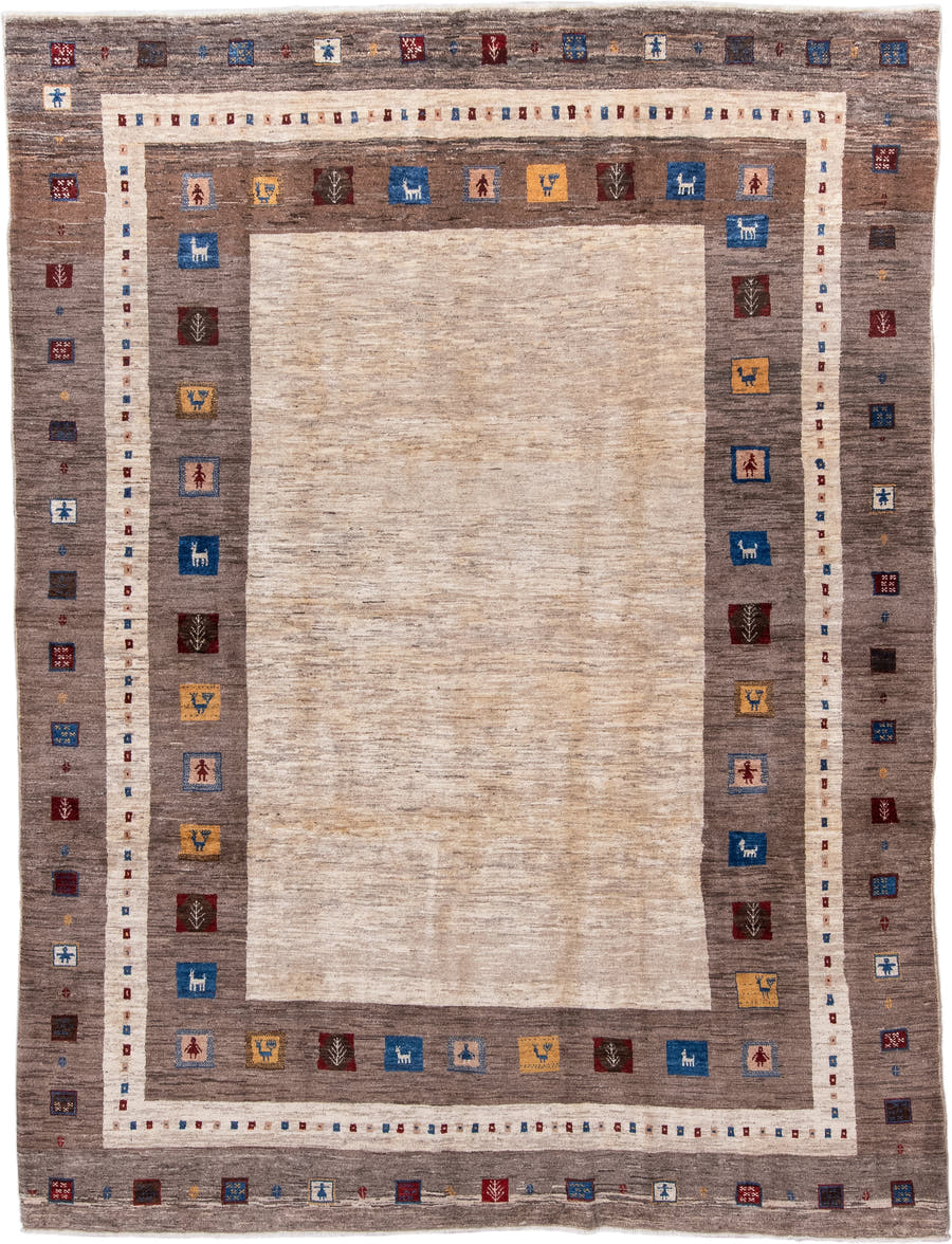 7' x 9' one-of-a-kind handmade vintage Gabbe rug. Color palette: ivory, taupe, brown, indigo, burgundy, gold, camel, beige