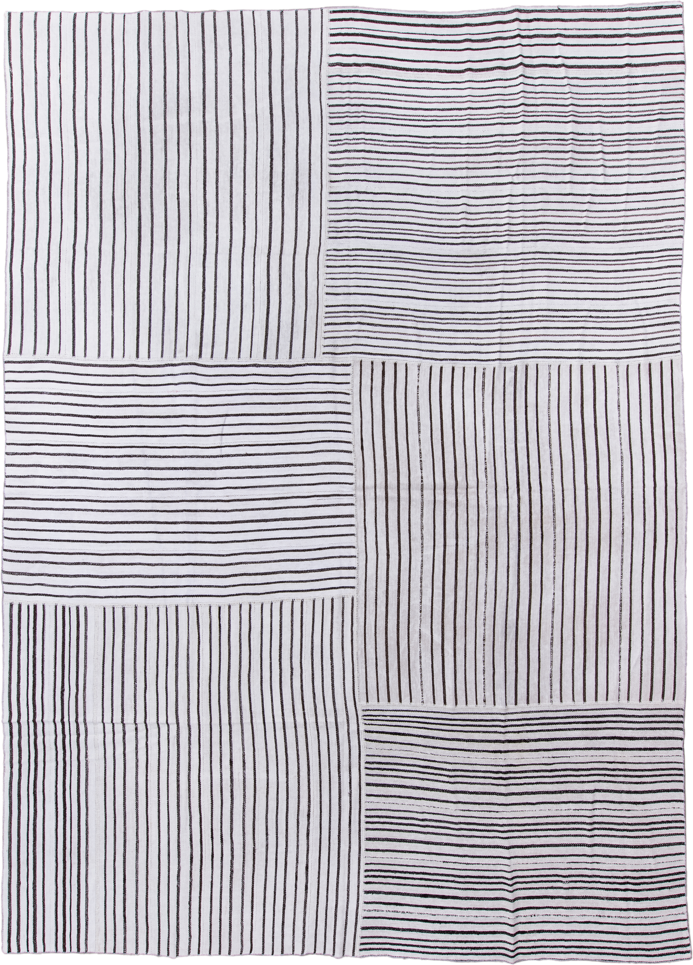 11' x 16' one-of-a-kind handmade antique Flatweave oversize rug. Color palette: ivory, charcoal, gray, black