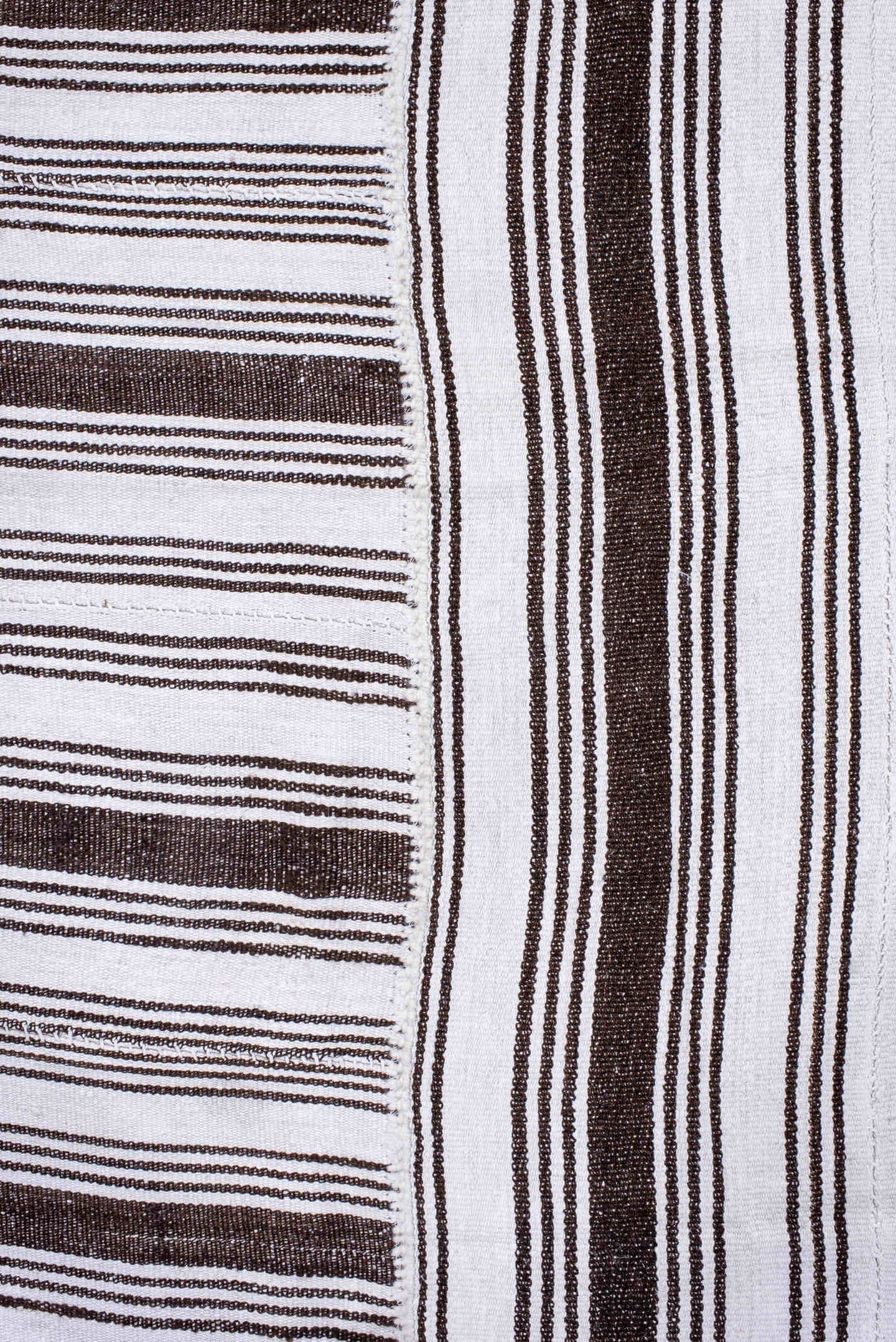 12' x 18' one-of-a-kind handmade antique Flatweave oversize rug. Color palette: ivory, dark brown, brown