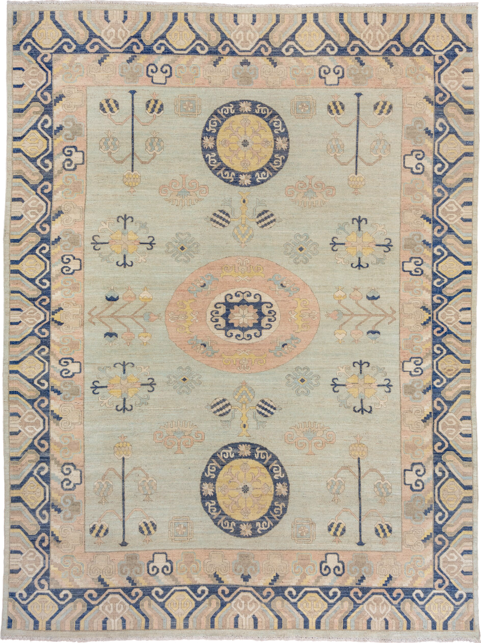 10' x 14' one-of-a-kind handmade vintage Khotan large size rug. Color palette: pale blue, ivory, navy, blush, beige, gold
