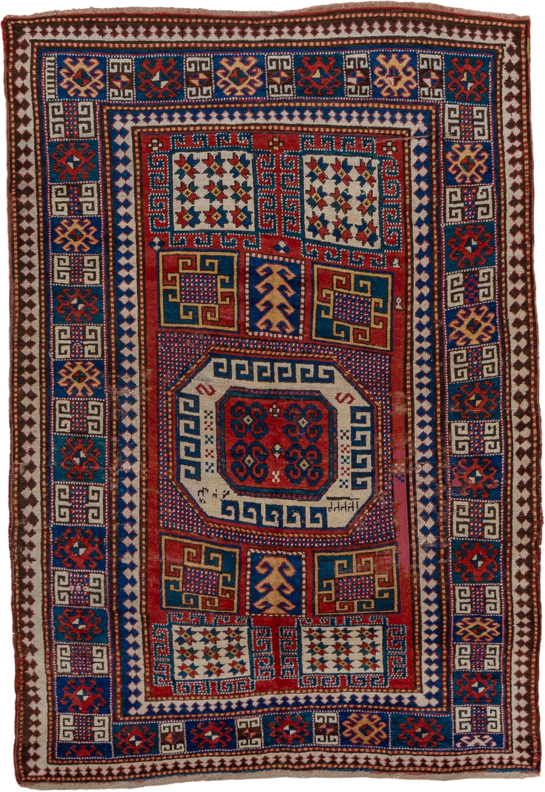 5' x 7' one-of-a-kind handmade vintage Kazak rug. Color palette: red, ivory, blue, navy, brown, rust, gold, terracotta